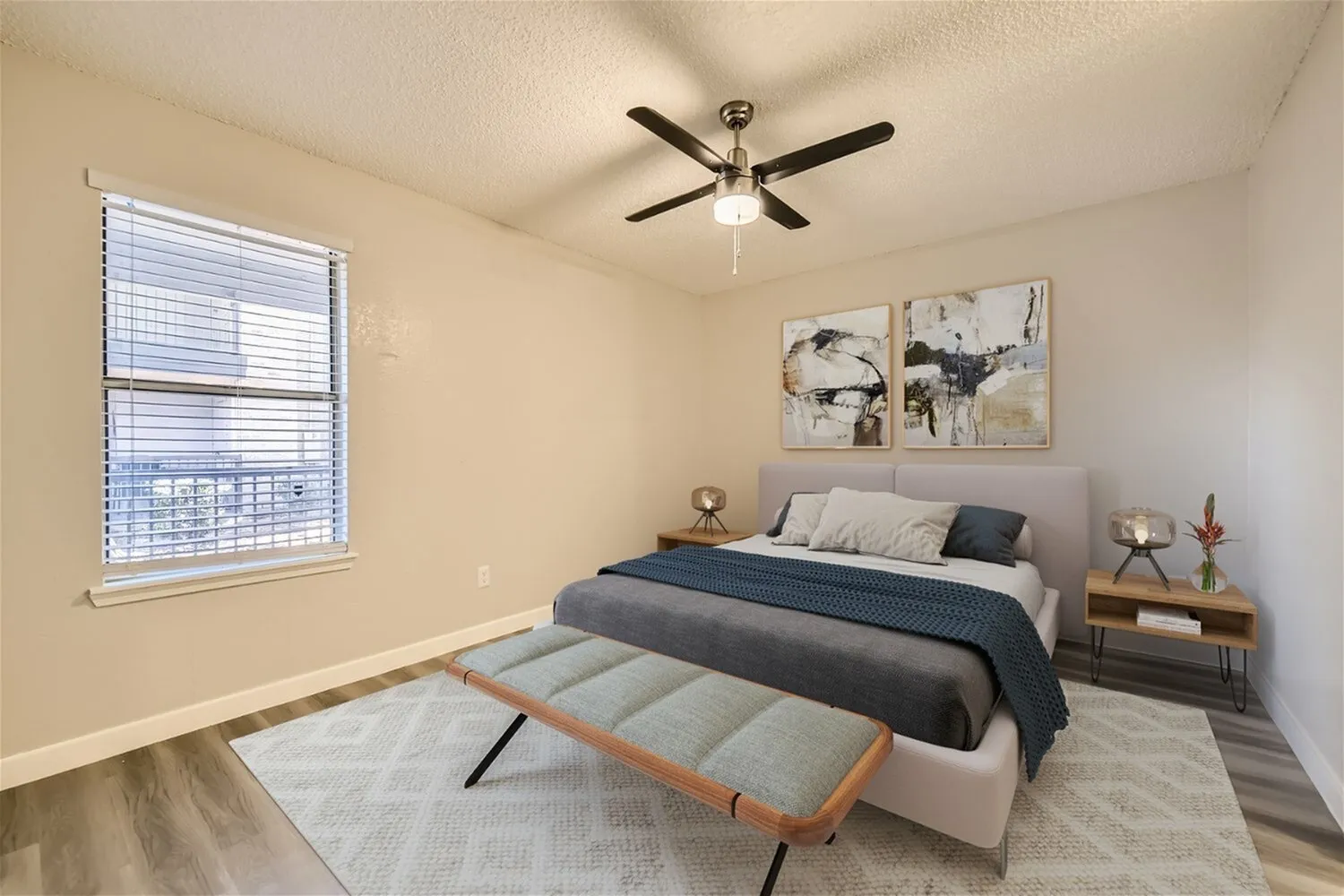 Bedroom, ceiling fan, window with horizontal blinds, neutral walls