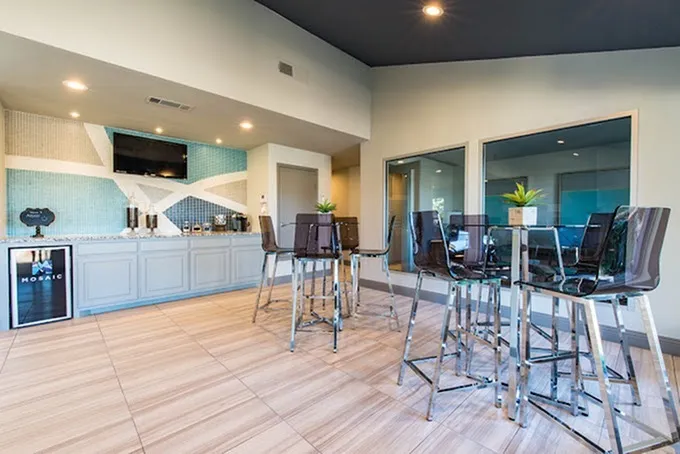 Coffee bar, cabinetry, tile backsplash, high-top seating