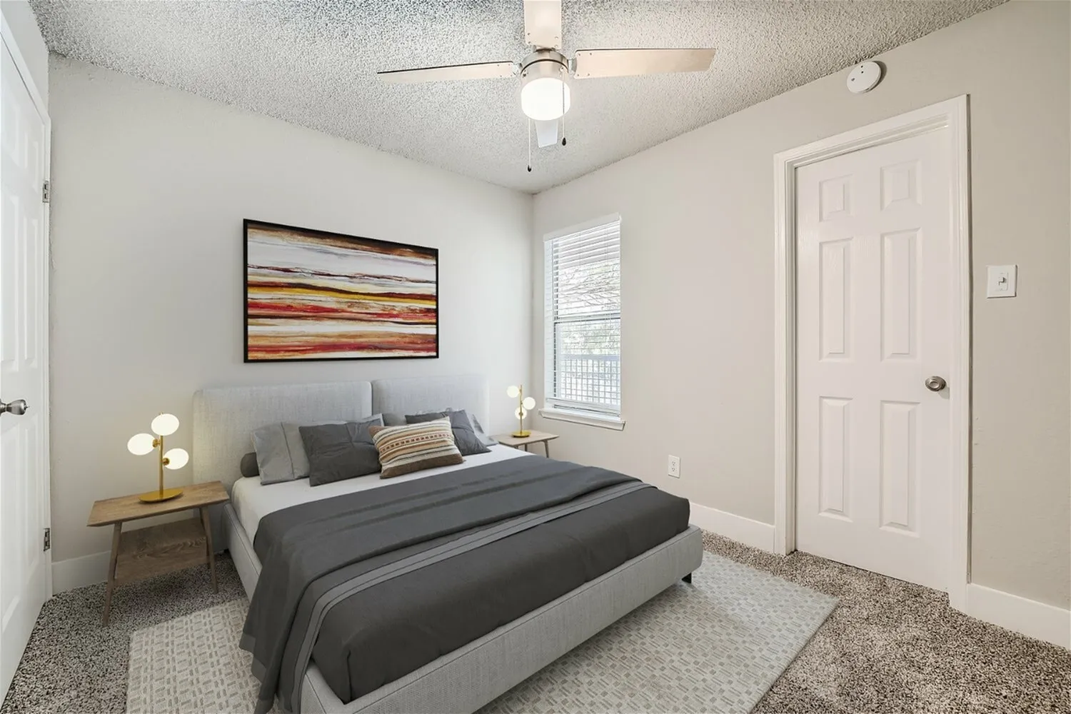Bedroom, window with blinds, carpet flooring, door