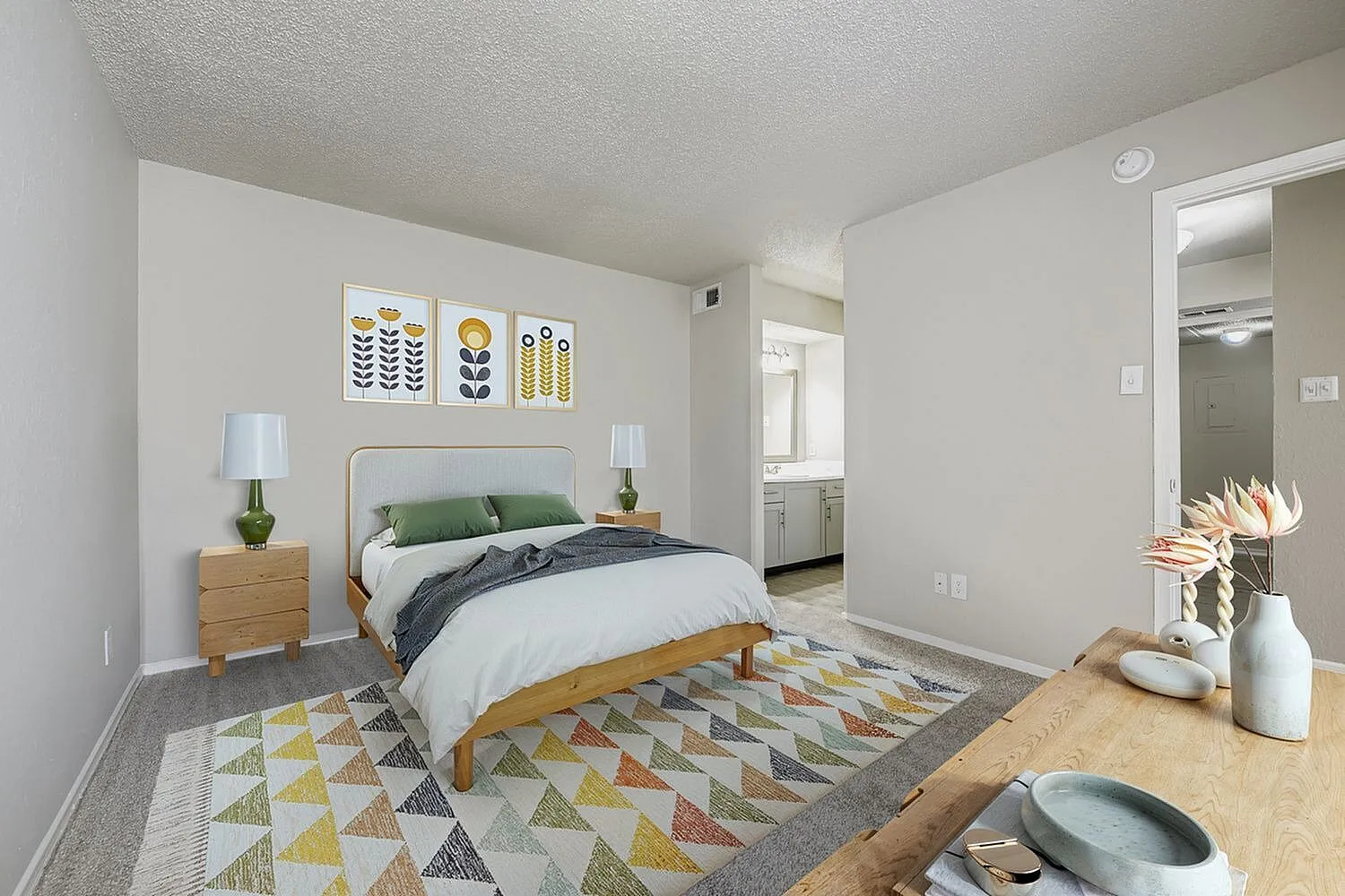 Bedroom, wood-style plank flooring, doorway to bathroom