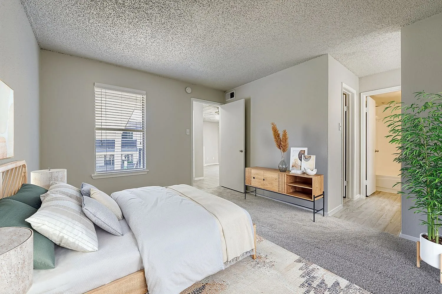 Bedroom, window with blinds, carpet flooring, doorway to hall