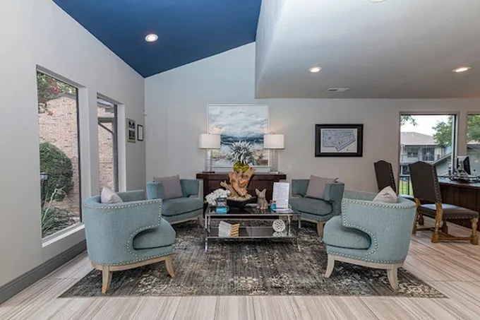 Clubhouse lounge, vaulted ceiling, recessed lighting, seating area