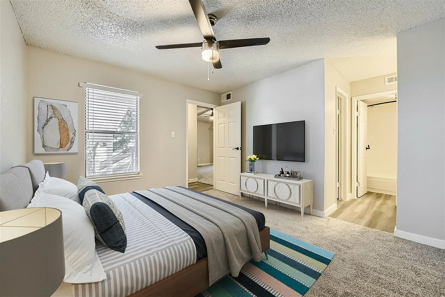 Bedroom, ceiling fan, window with horizontal blinds, carpet flooring, closet doorway