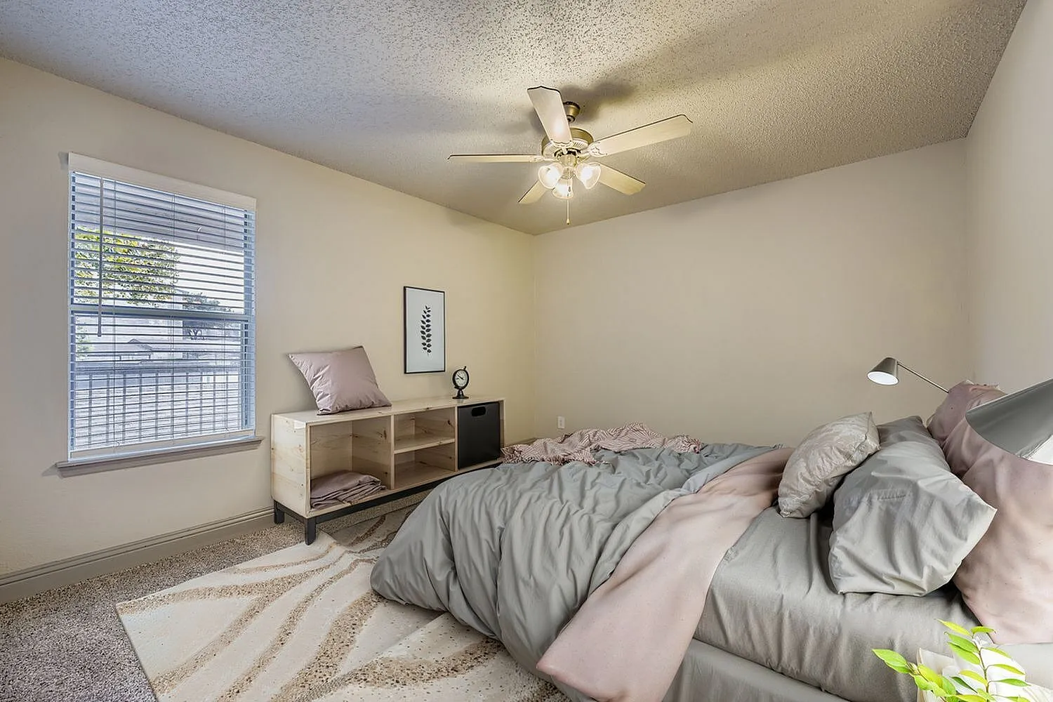 Bedroom, ceiling fan, window with blinds, carpet flooring
