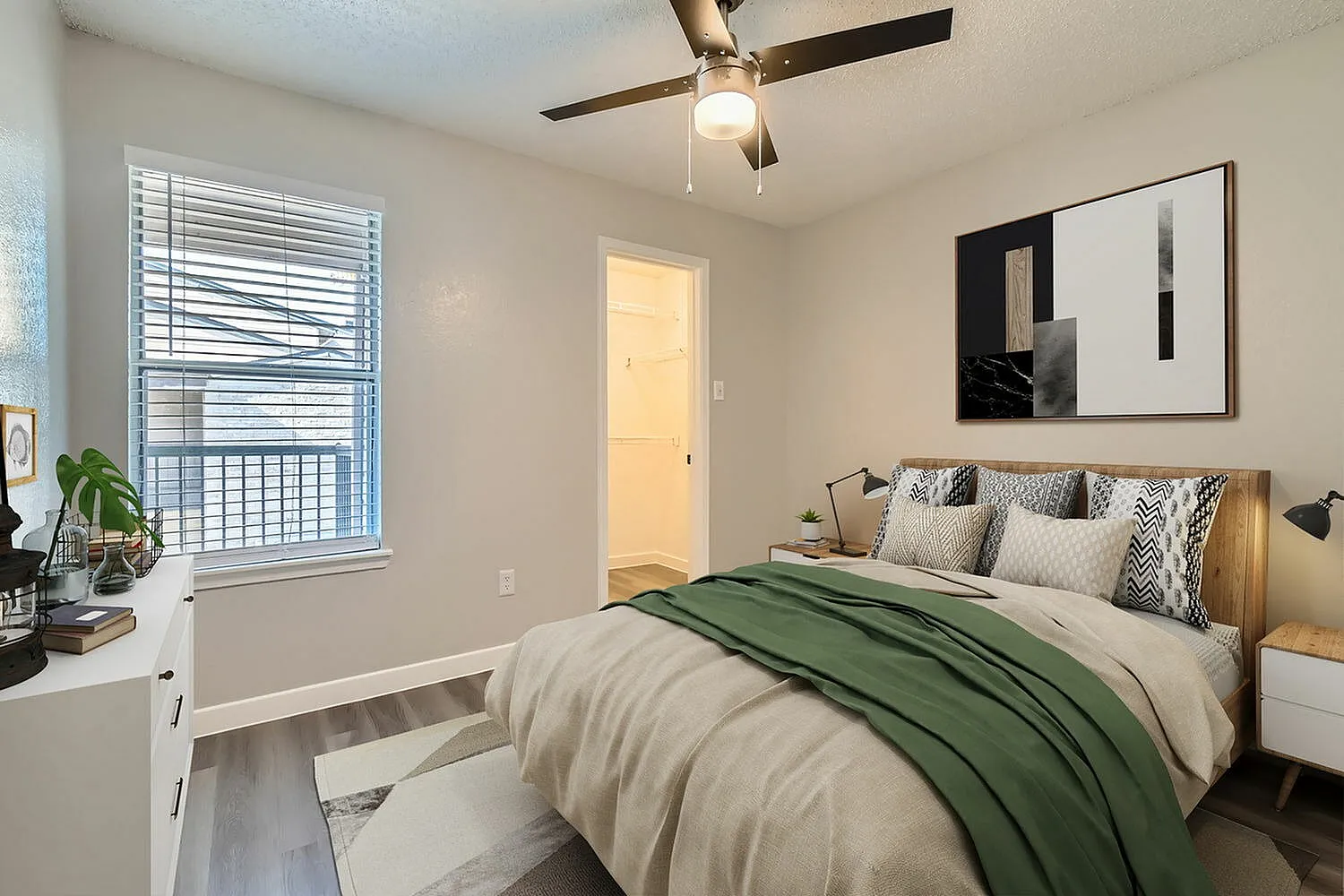 Bedroom, ceiling fan, window with blinds, walk-in closet, wood-style plank flooring