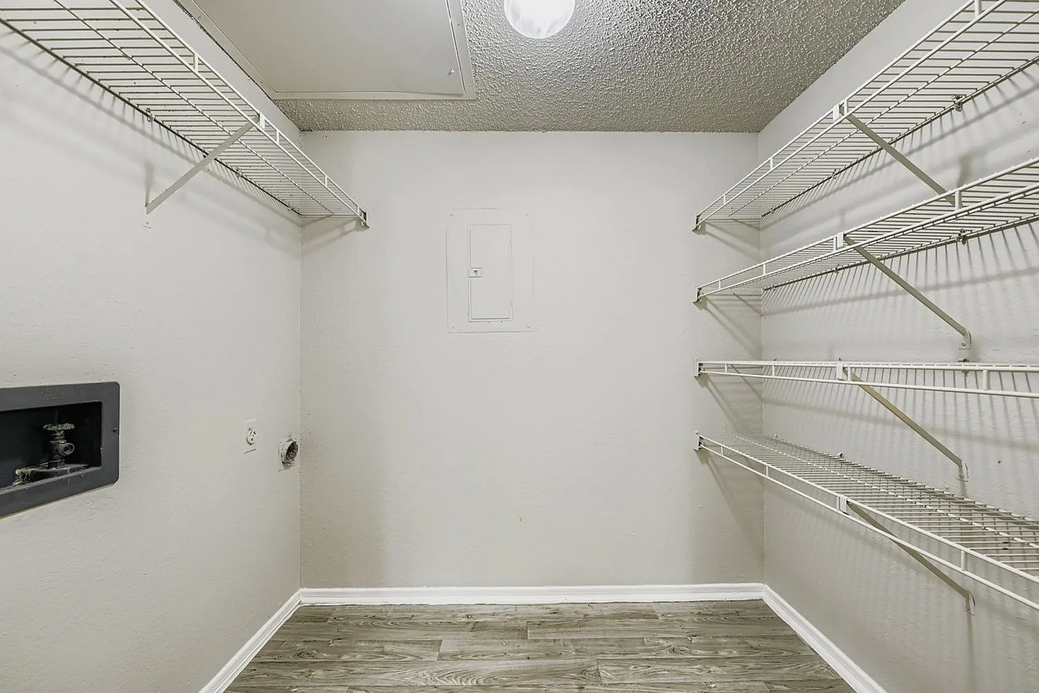 Walk-in closet, wire shelving, electrical panel