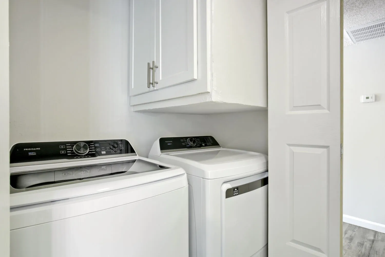 Laundry closet with washer and dryer