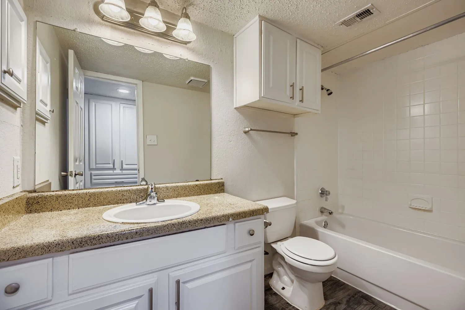 Bathroom vanity with tub and shower combo
