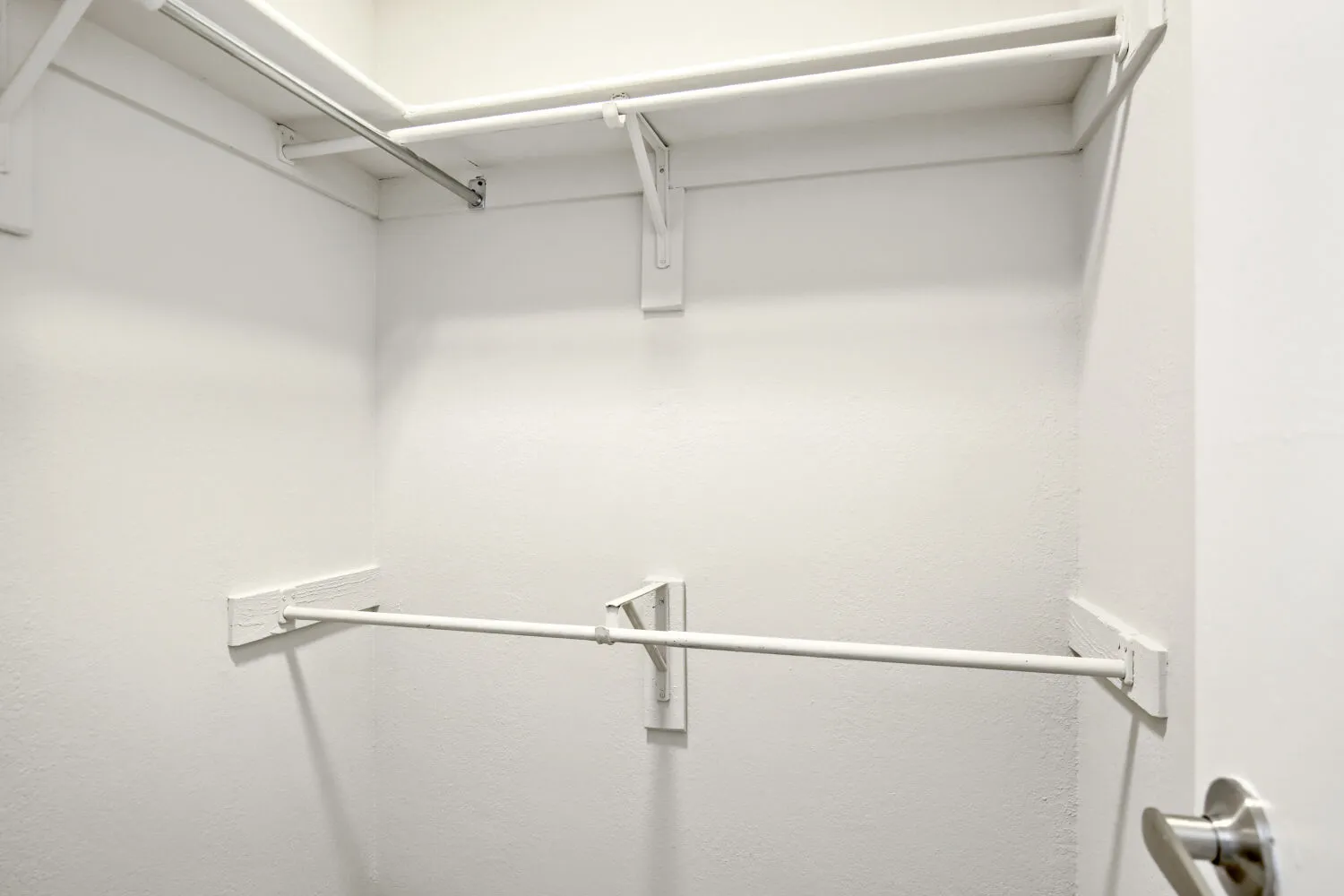 Closet with built-in shelf and hanging rods