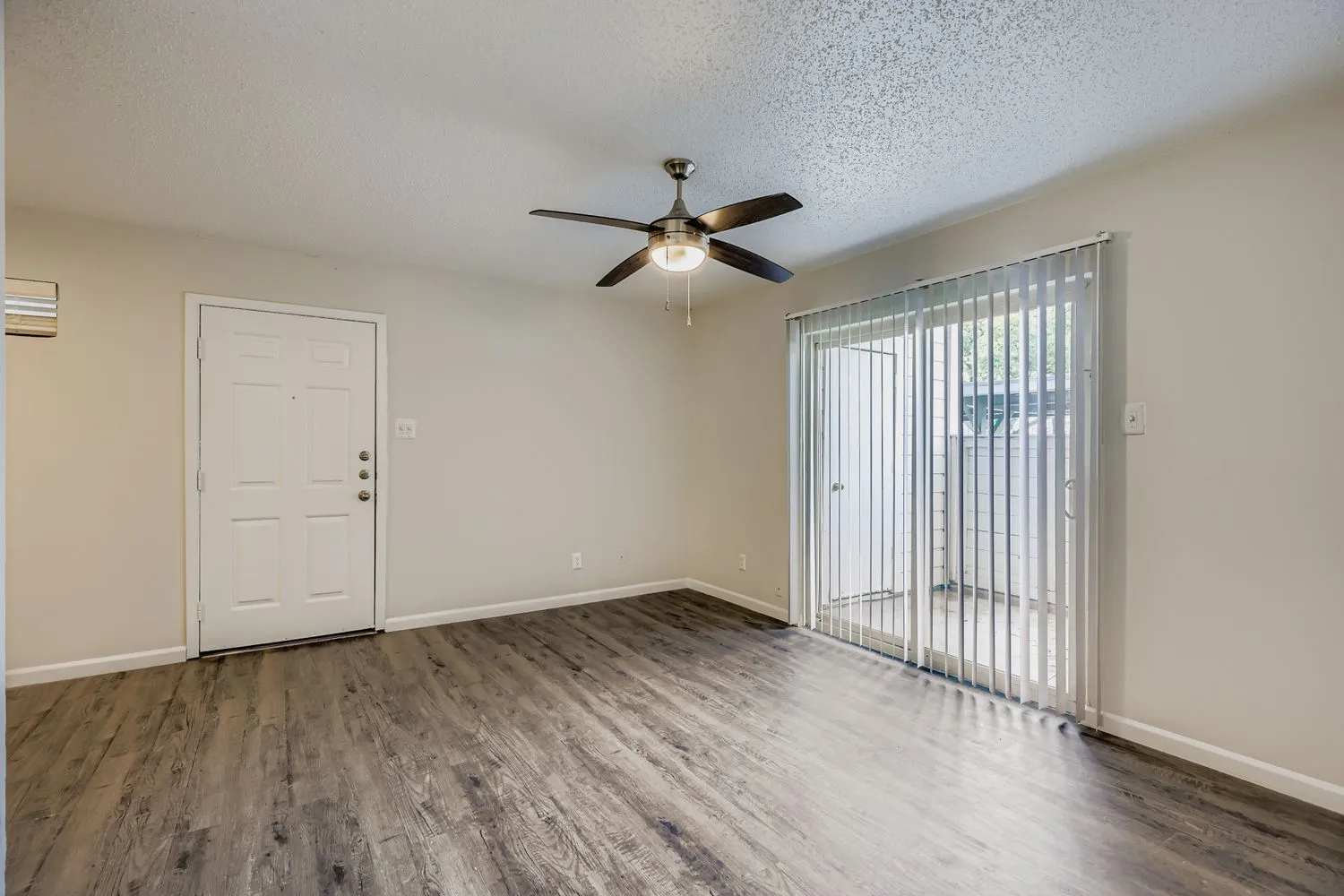 A1 Silver floor plan living room with wood-style plank flooring and sliding glass door