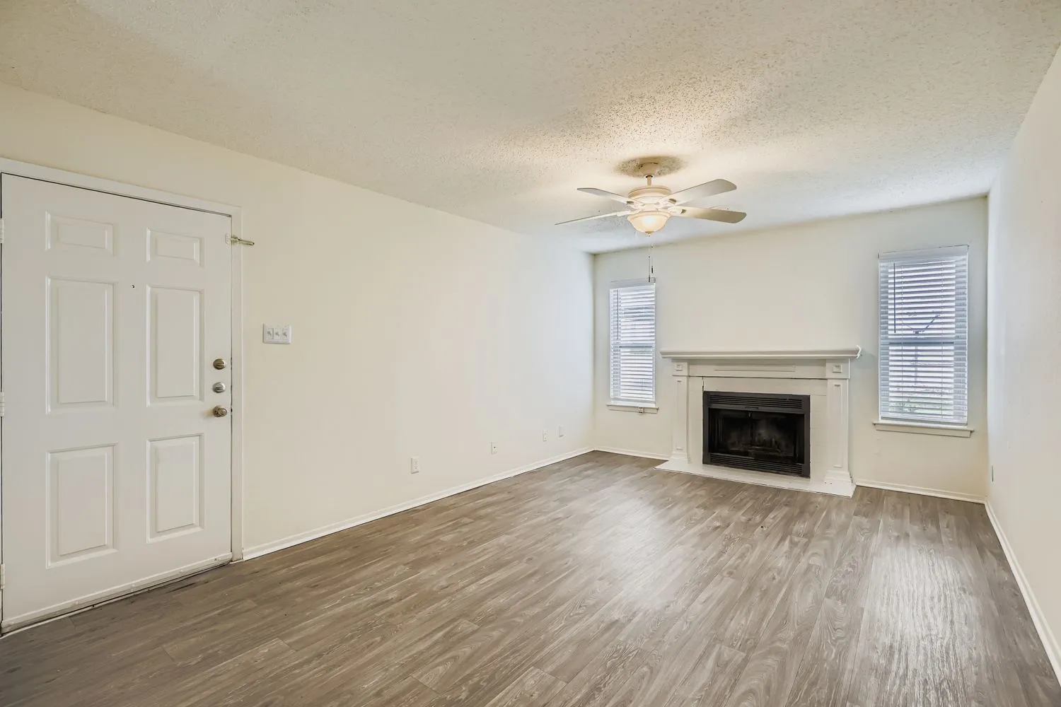 C1 Silver floor plan living room with fireplace and wood-style plank flooring