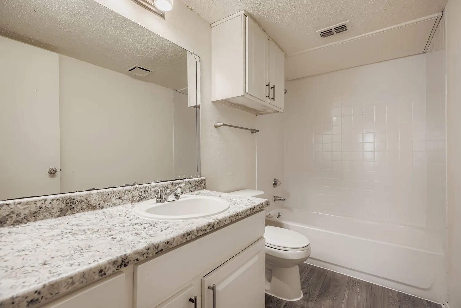Bathroom vanity with tub and shower combo