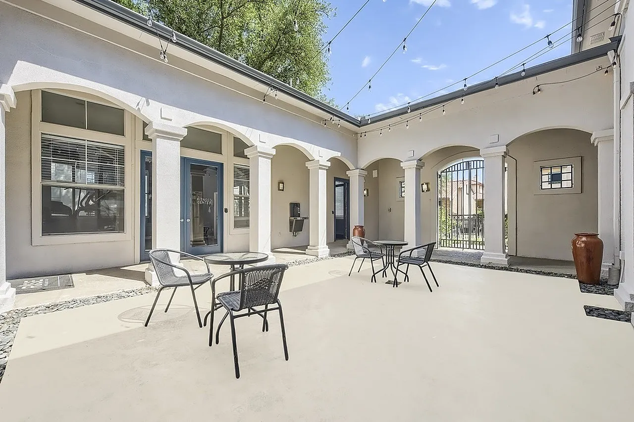Courtyard, arched columns, light fixtures, seating areas, planter