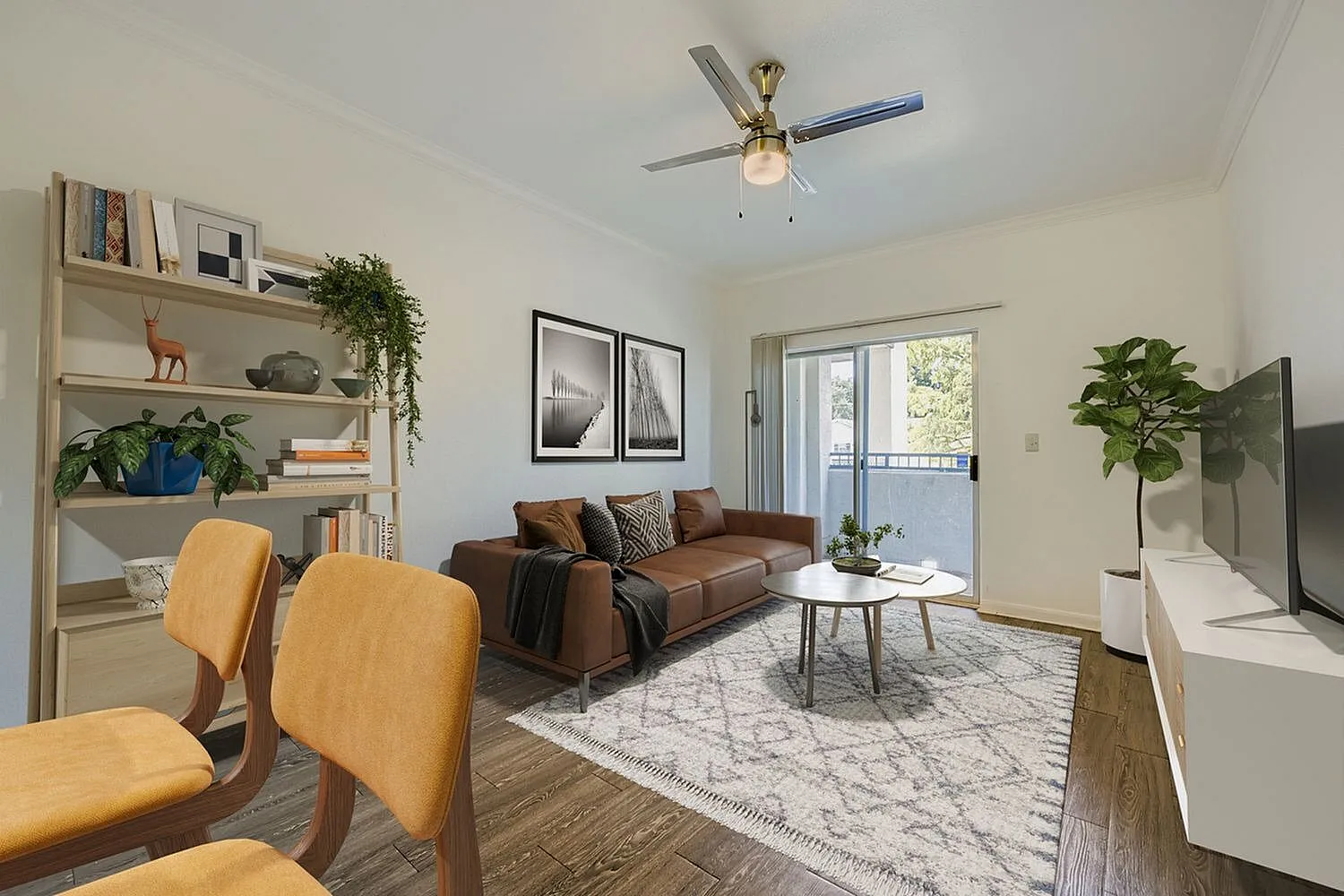 Living room, wood-style plank flooring, brown leather sofa, ceiling fan, patio door