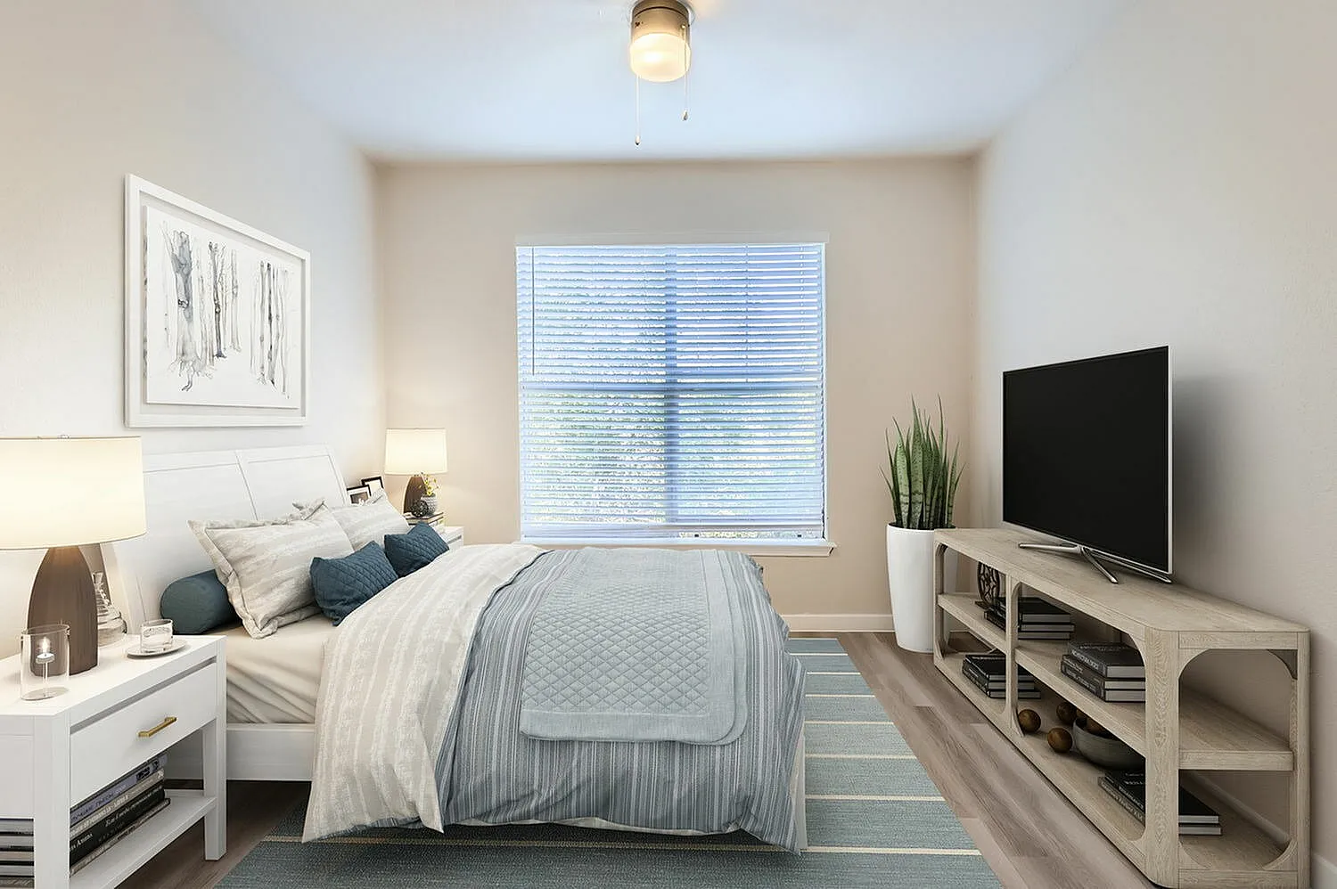 Primary bedroom, wood-style plank flooring, floating white nightstand, quilted bedding