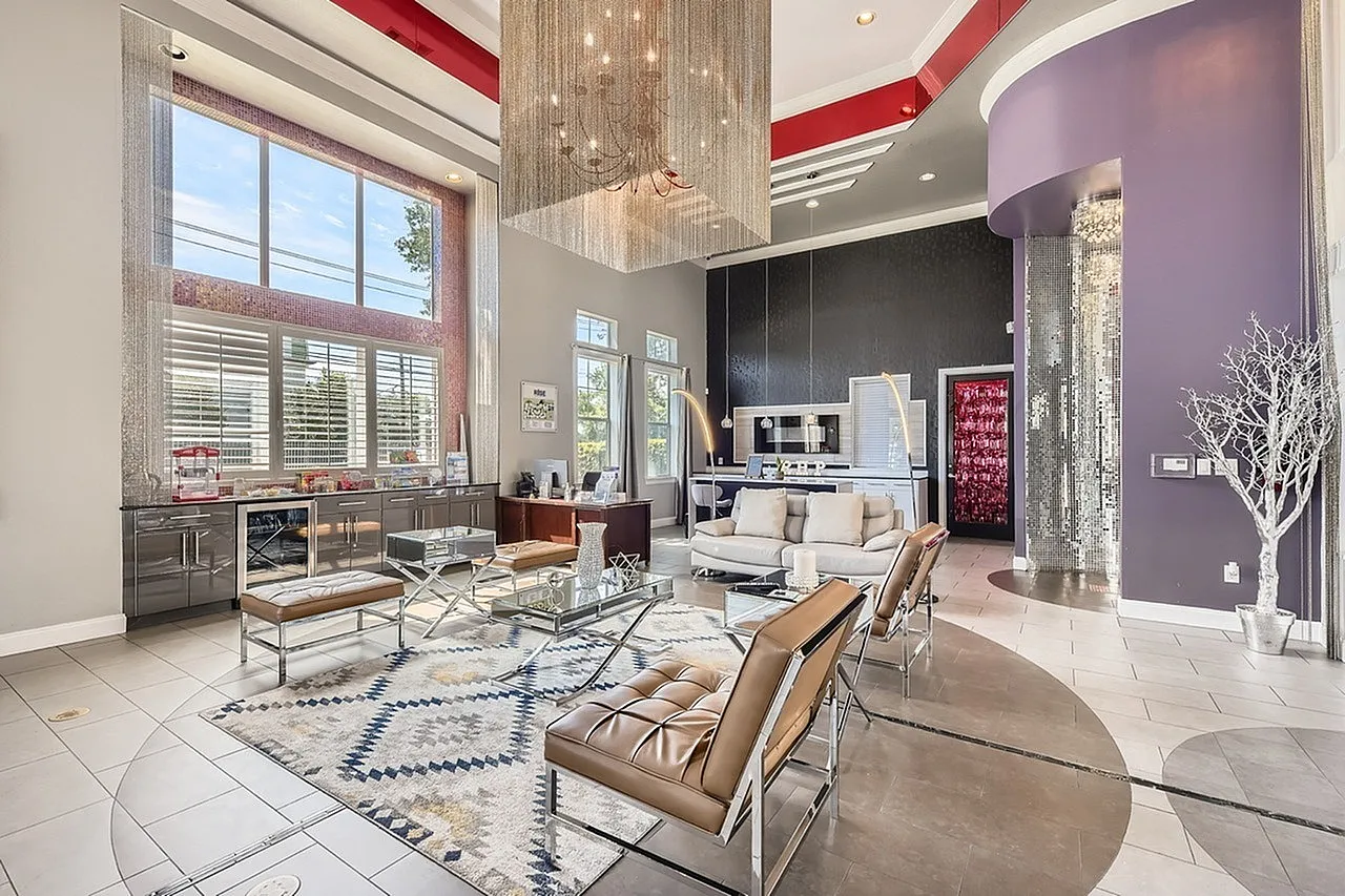 Lobby, wood-style plank flooring, contemporary furniture, burgundy ceiling accent, modern lighting