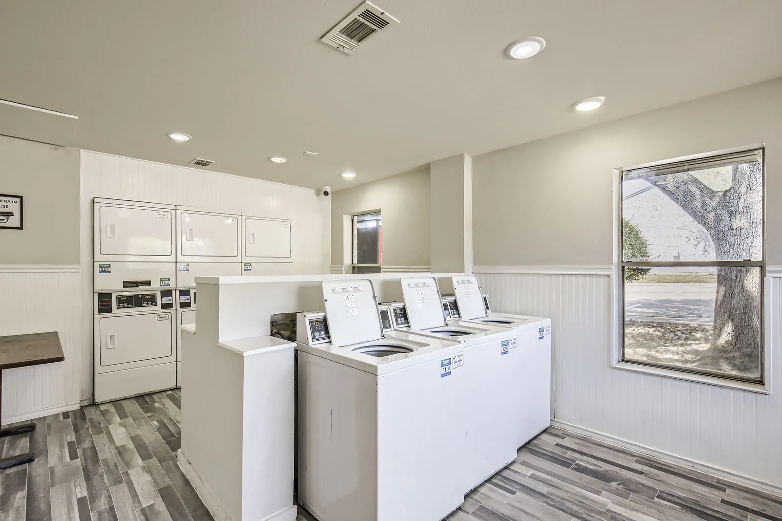 Community laundry room, washers and dryers, wood-style plank flooring