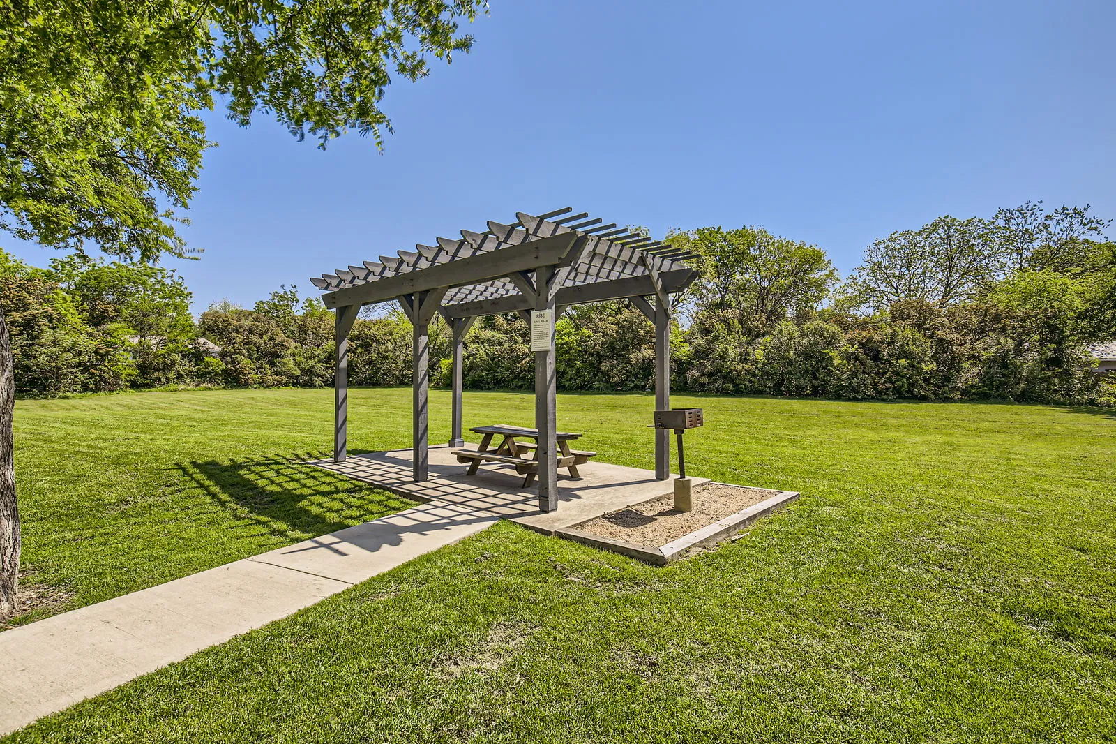 Covered picnic pavilion, grill station, picnic table, open lawn