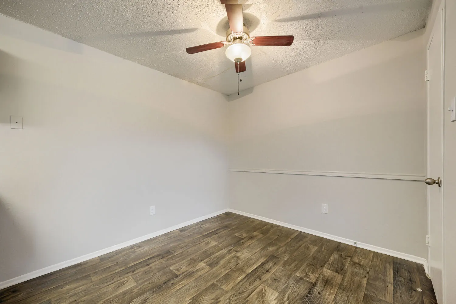 Dining area, ceiling fan, wood-style plank flooring, open to kitchen