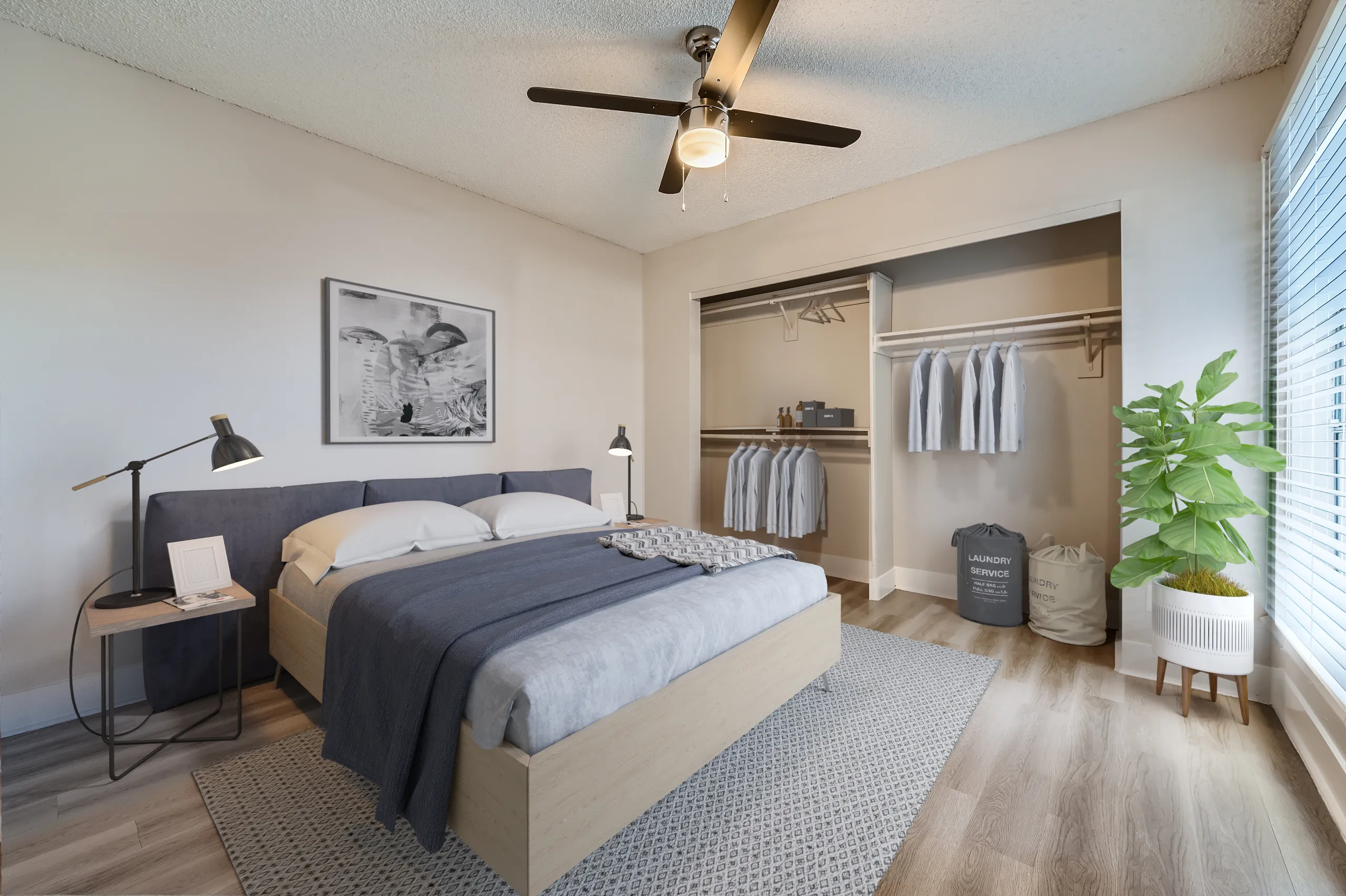 Bedroom, ceiling fan, reach-in closet, wood-style plank flooring