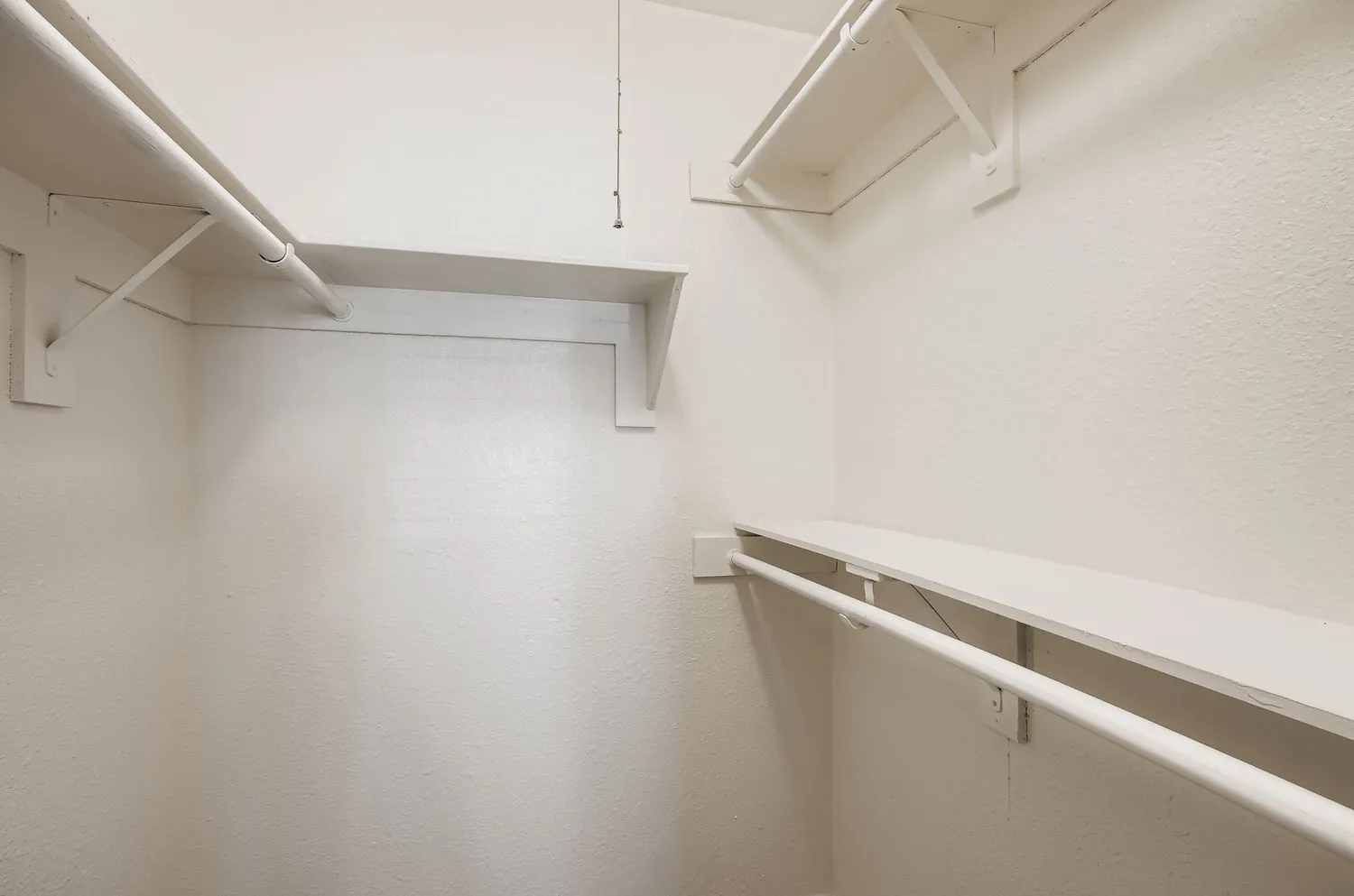 Walk-in closet, hanging rods, built-in shelving