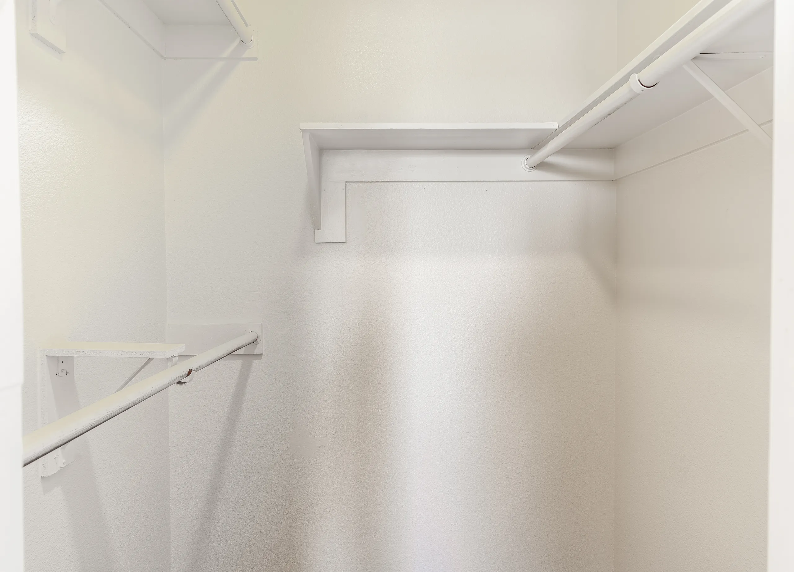 Walk-in closet, hanging rods, built-in shelving