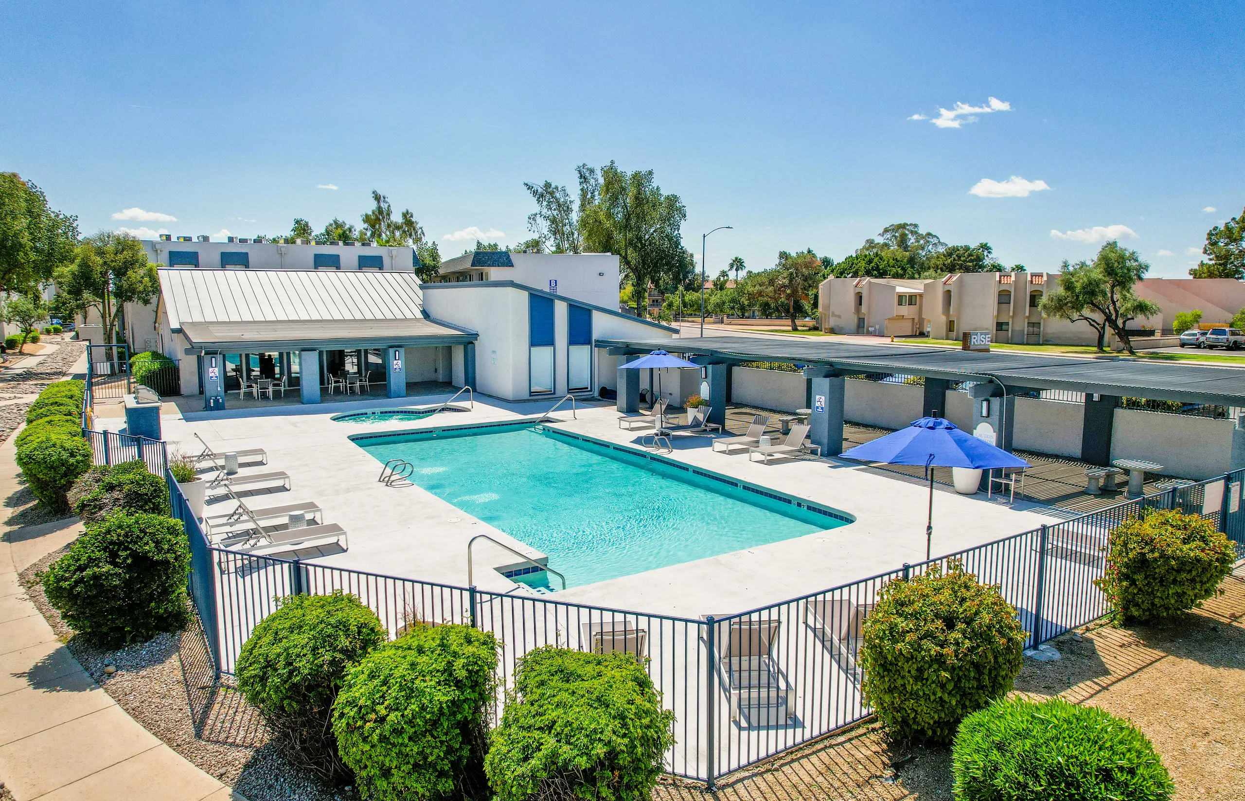 Aerial view, resort-style pool, spa, shaded lounge area