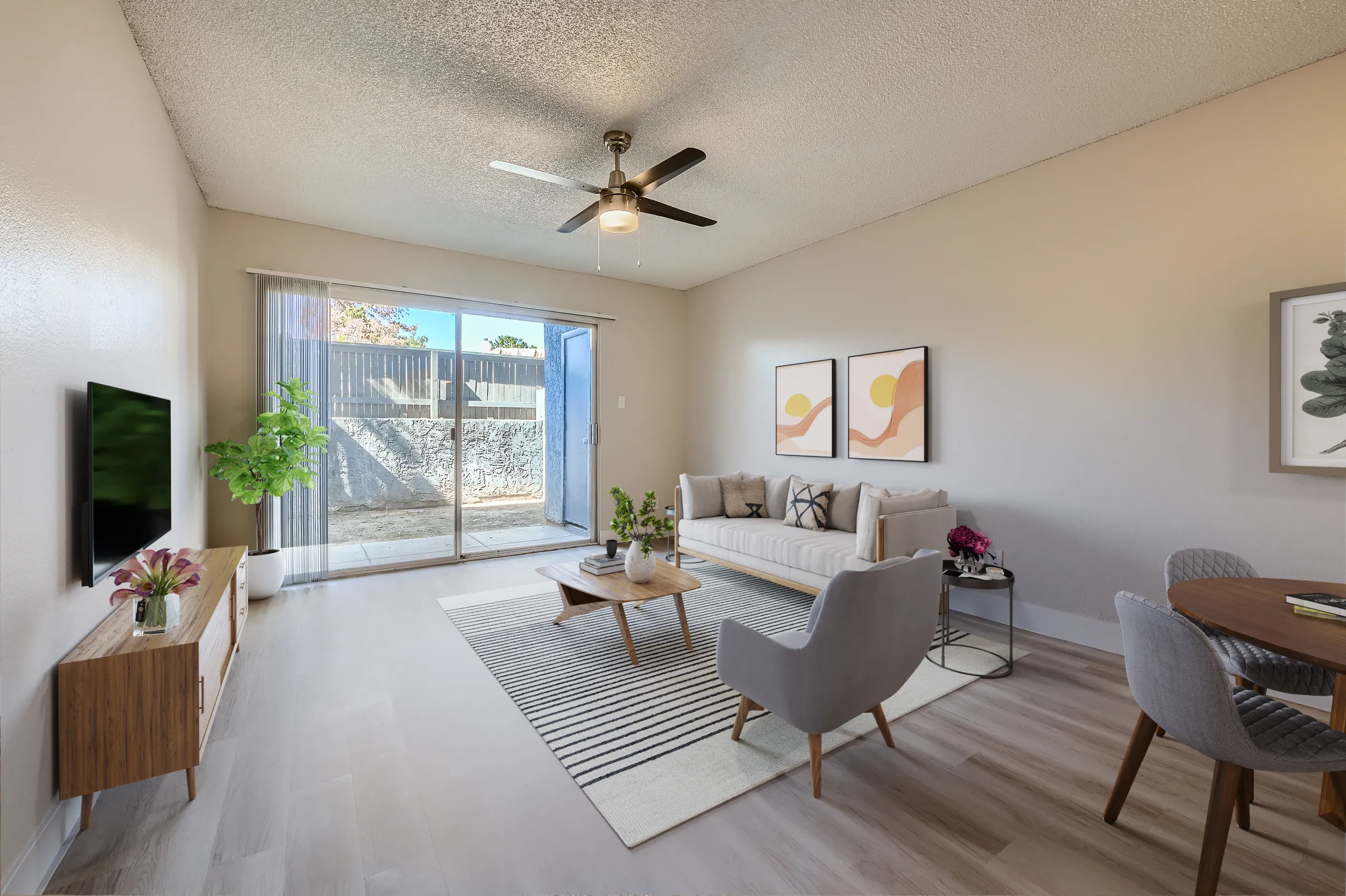 B1 Platinum living room, ceiling fan, sliding glass door, private patio access