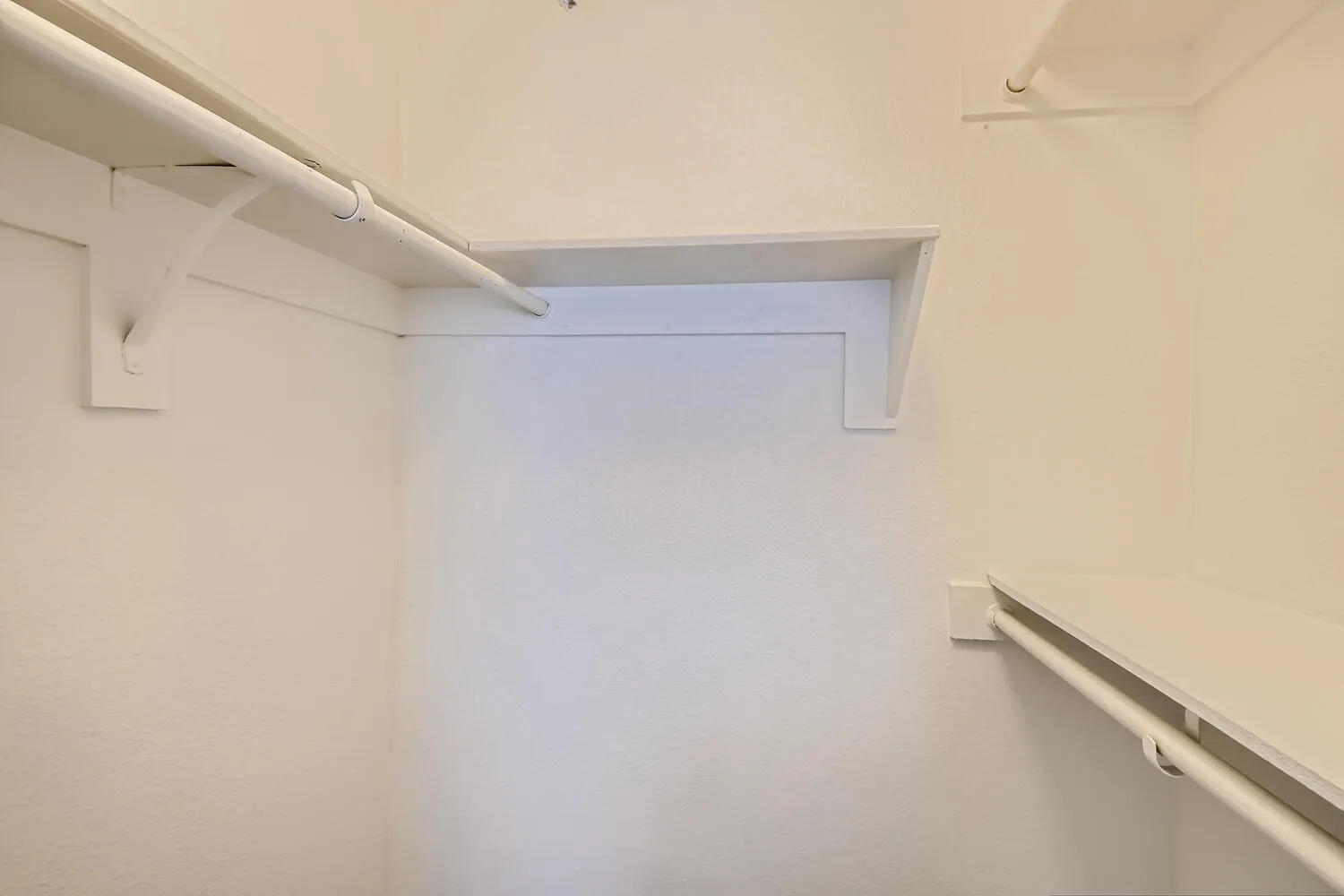 Walk-in closet, built-in shelving, hanging rod storage