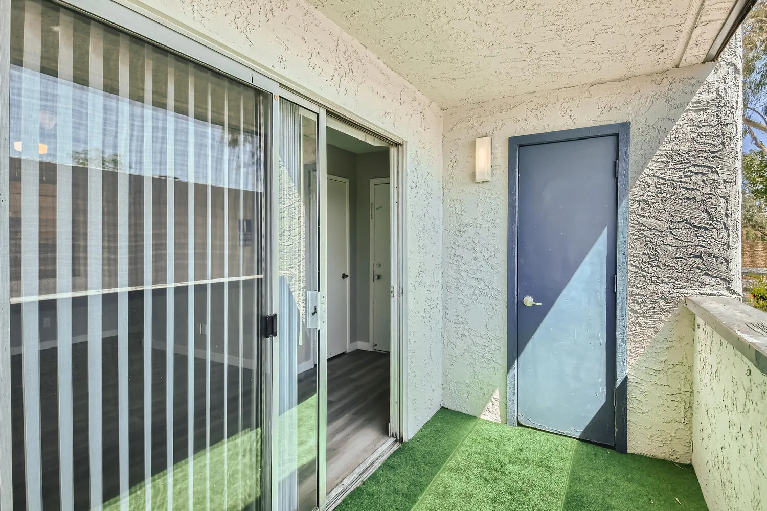 Private balcony, sliding glass door, exterior storage closet
