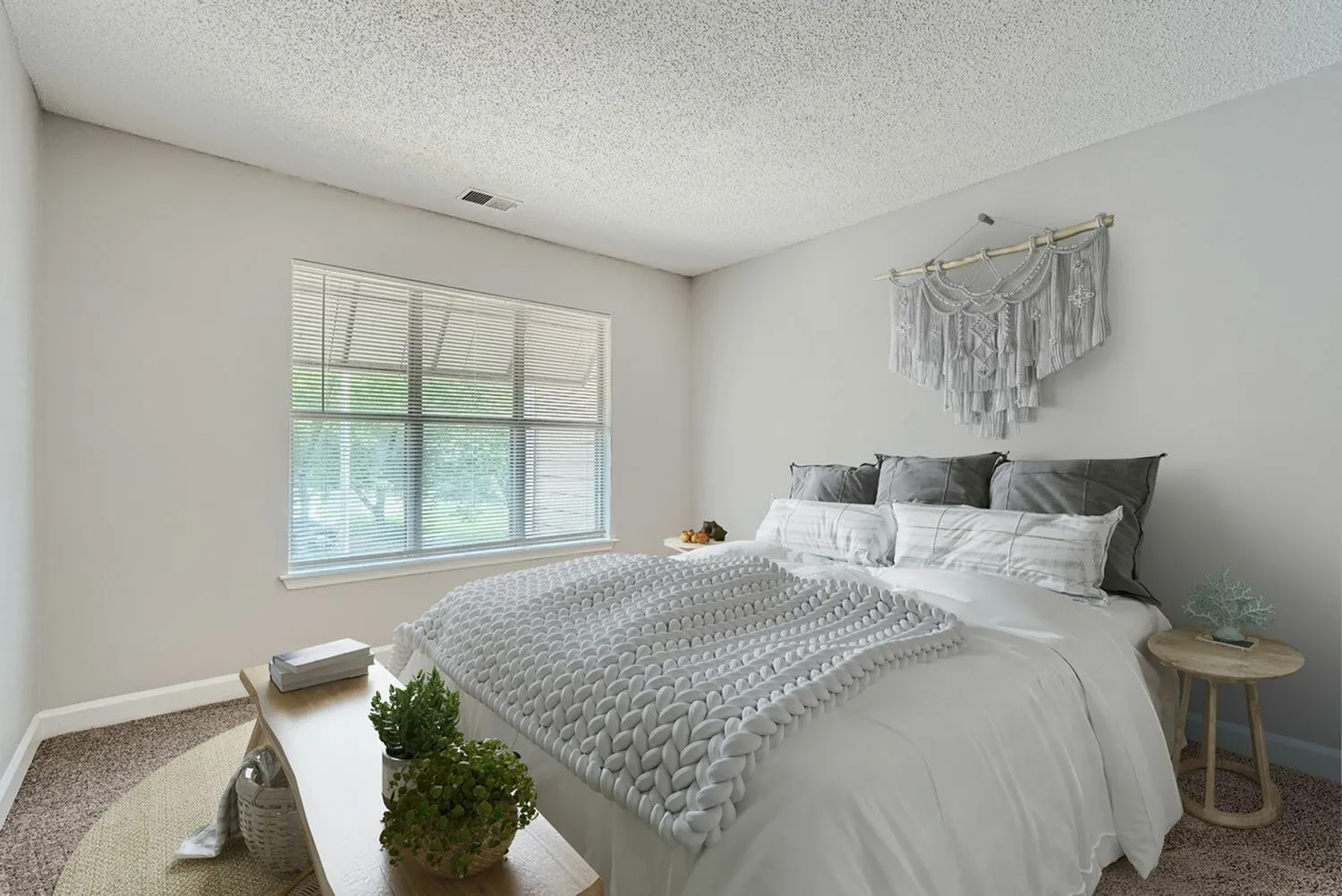 Bedroom with wood-style plank flooring, window with natural light