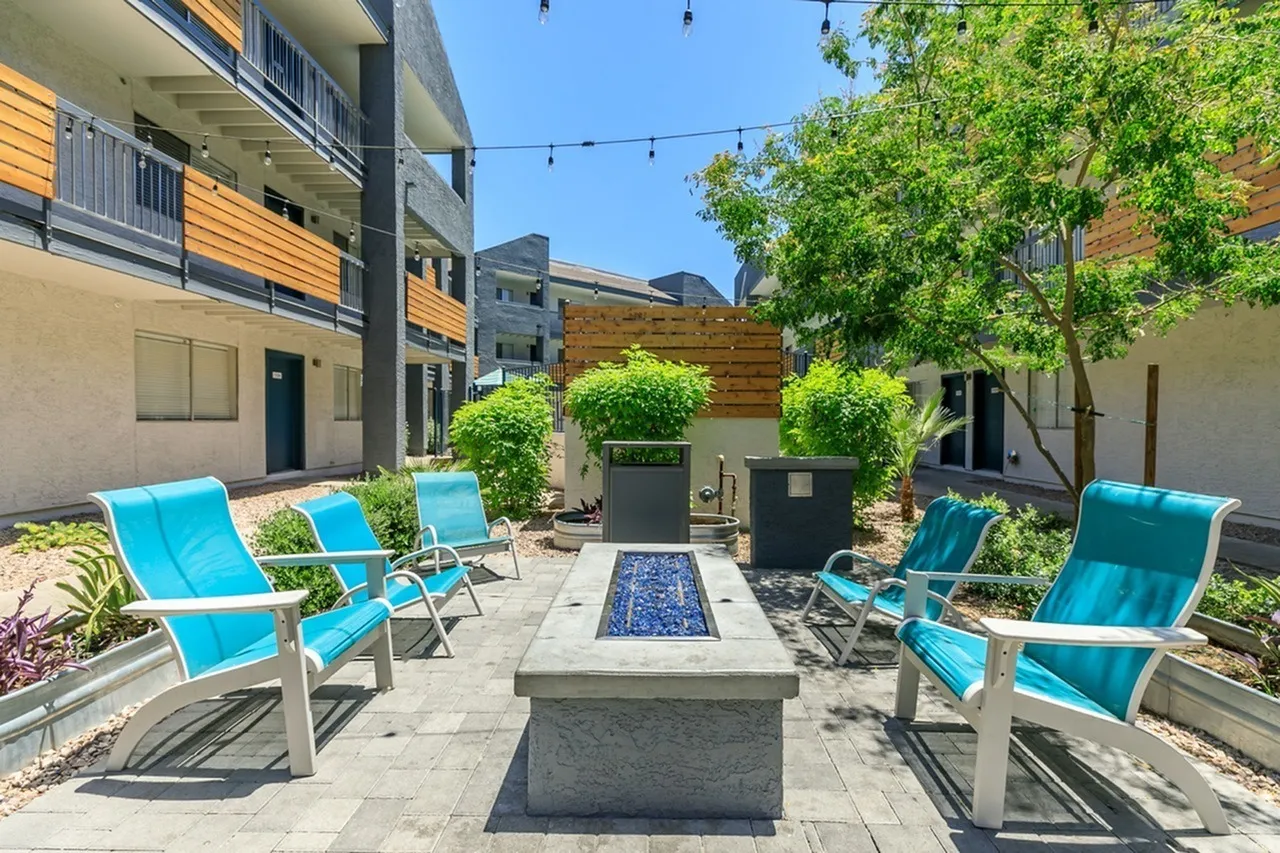 Courtyard with lounge chairs, fire pit, trees, Phoenix