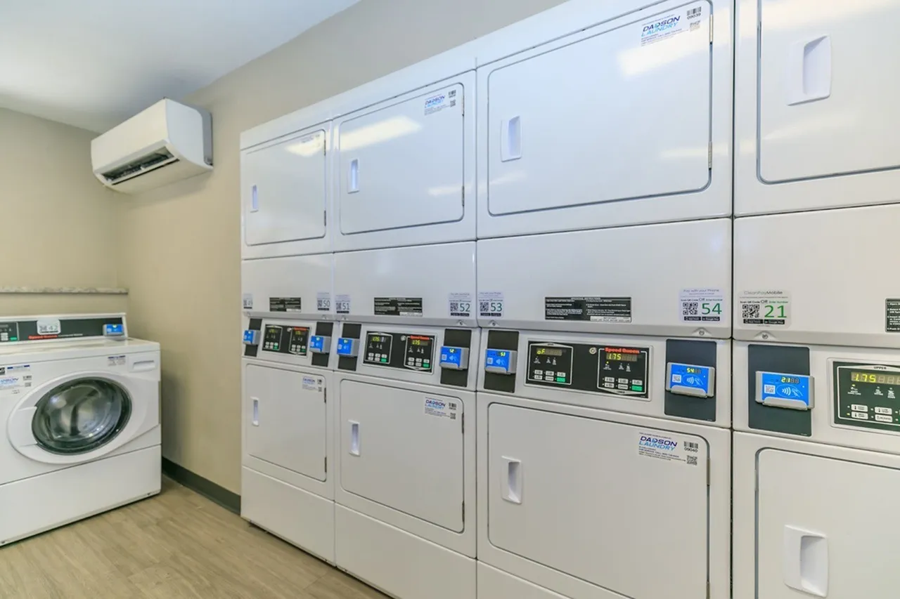 Laundry room, commercial washers and dryers, digital controls, window air conditioning unit