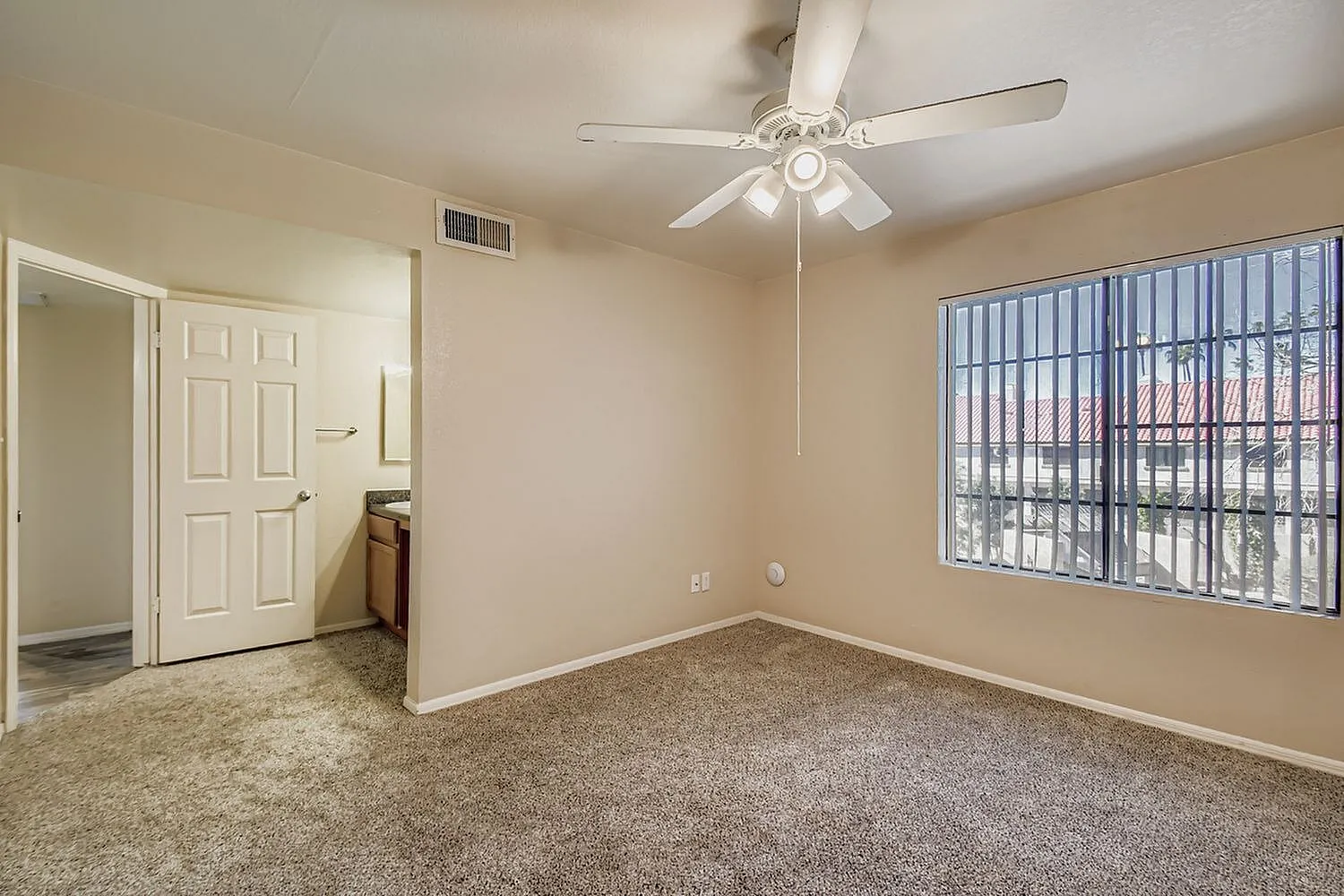 Bedroom, carpet flooring, ceiling fan with light fixture, large barred window