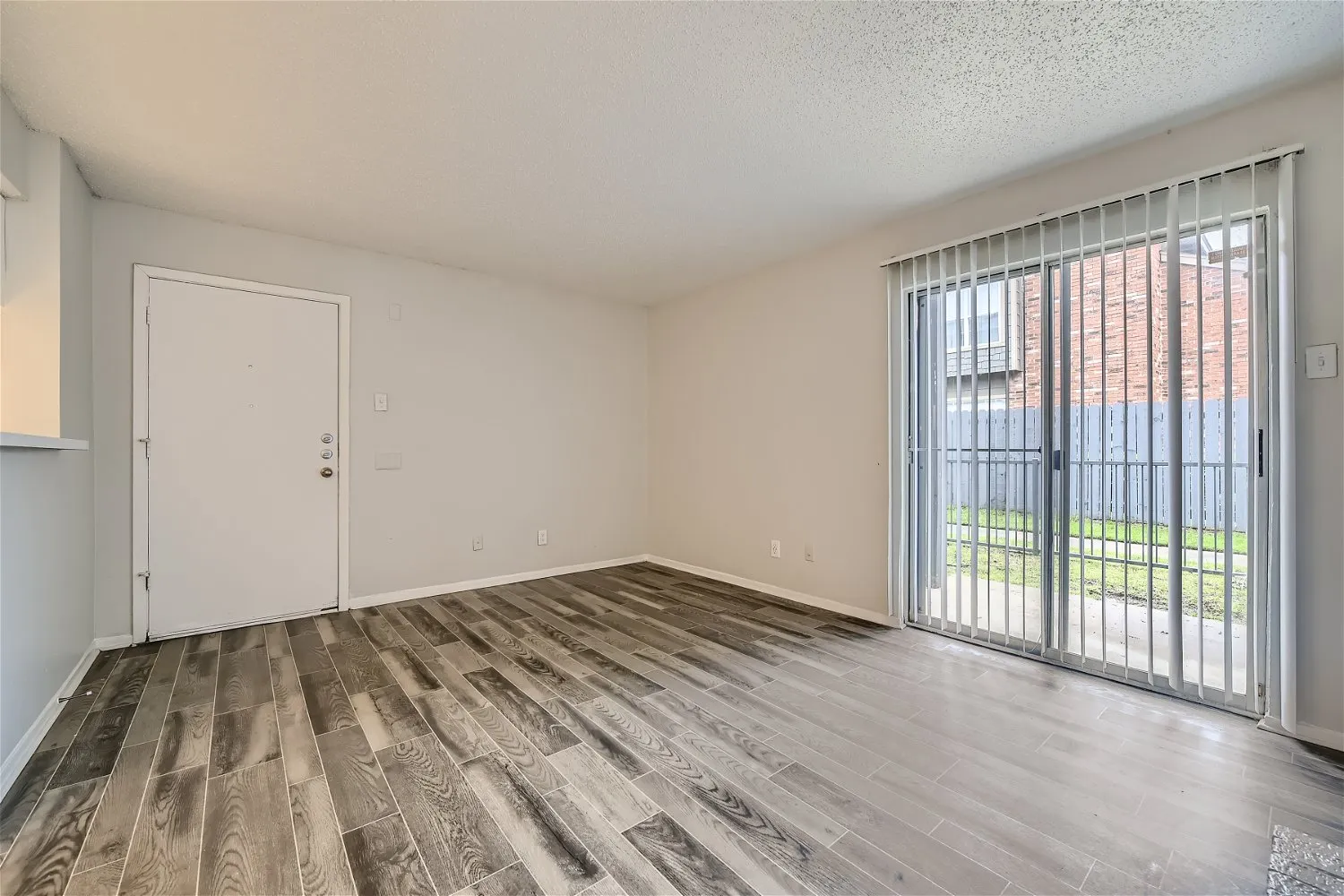Living room with sliding glass door and entry