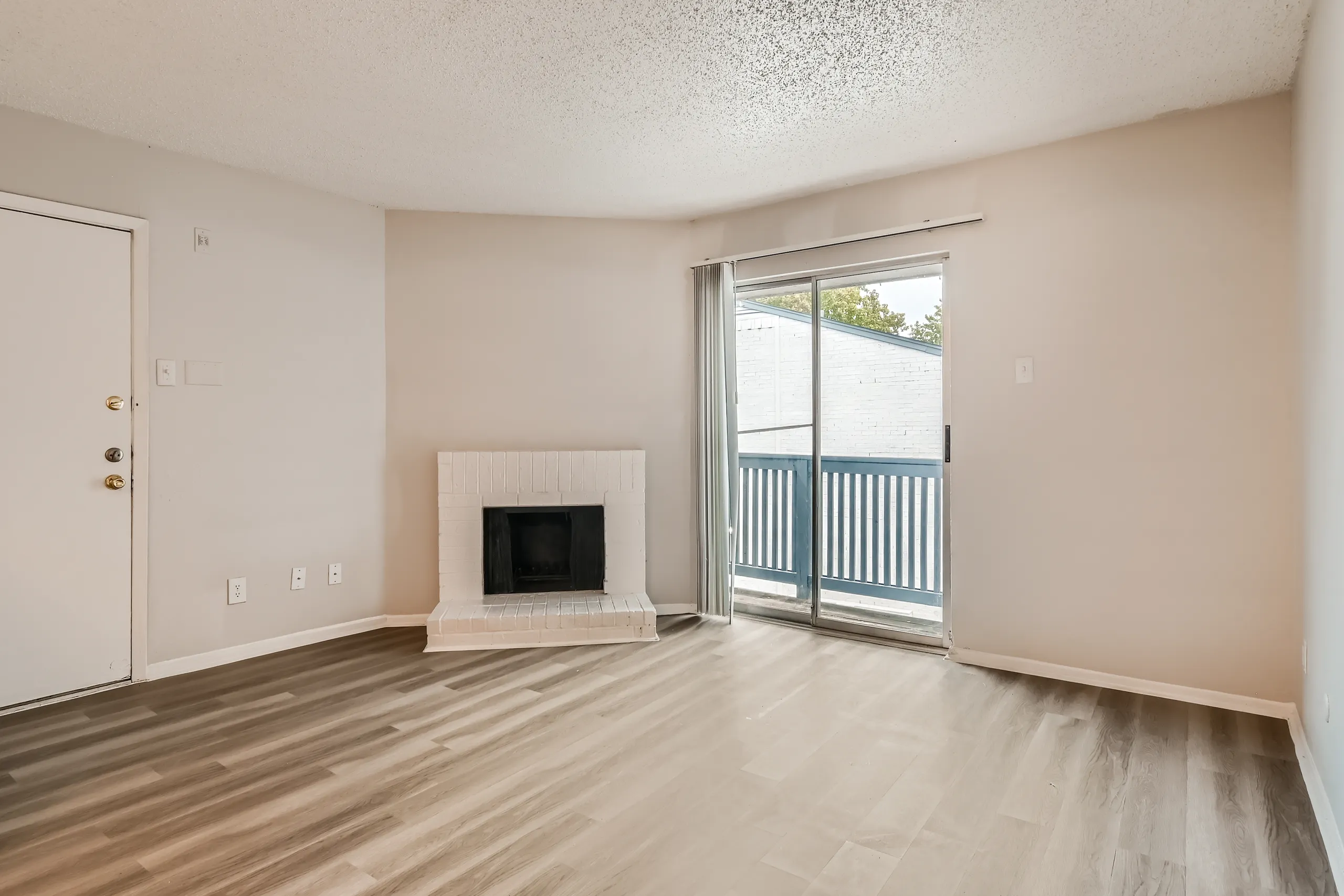 A1 Silver floor plan living room with brick fireplace and sliding glass door