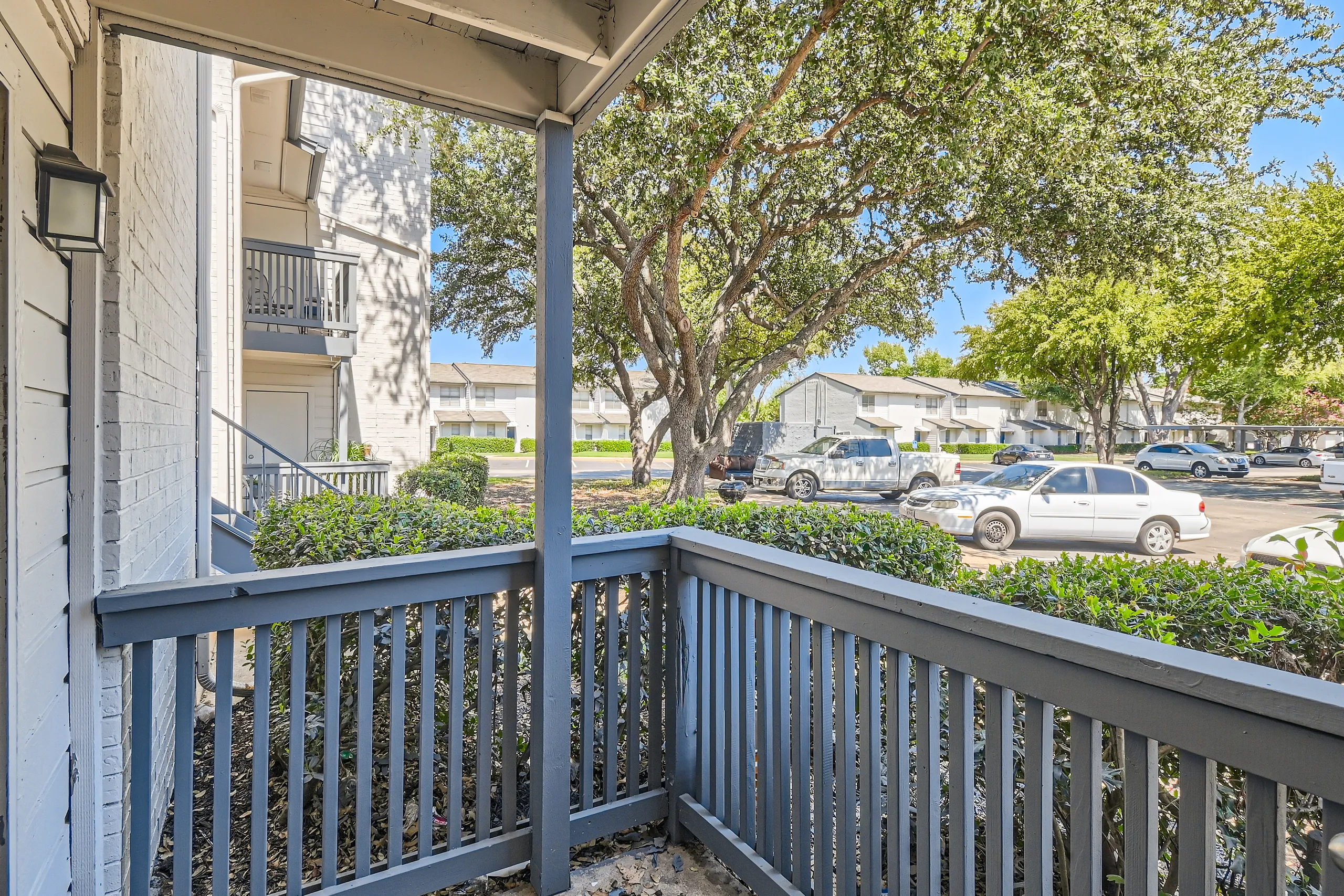 Private patio with courtyard and parking view