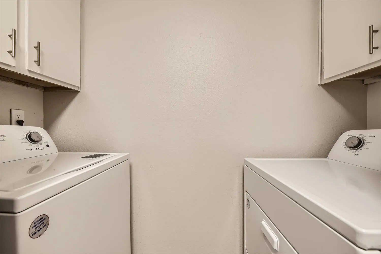 In-unit laundry room with washer and dryer