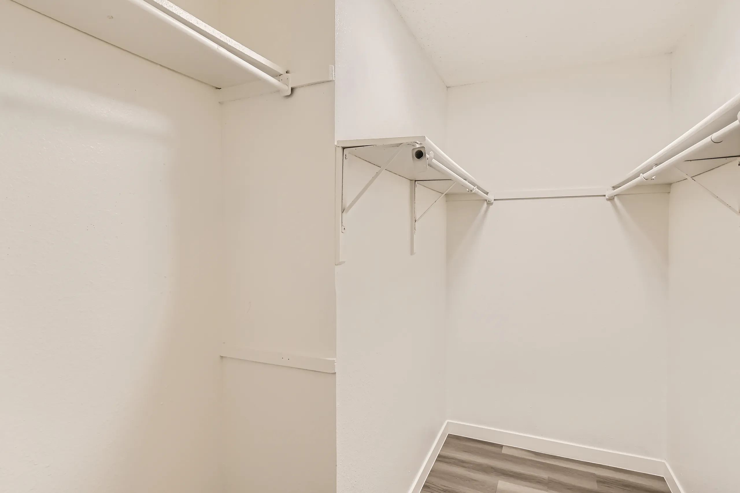 Walk-in closet with shelving and hanging space