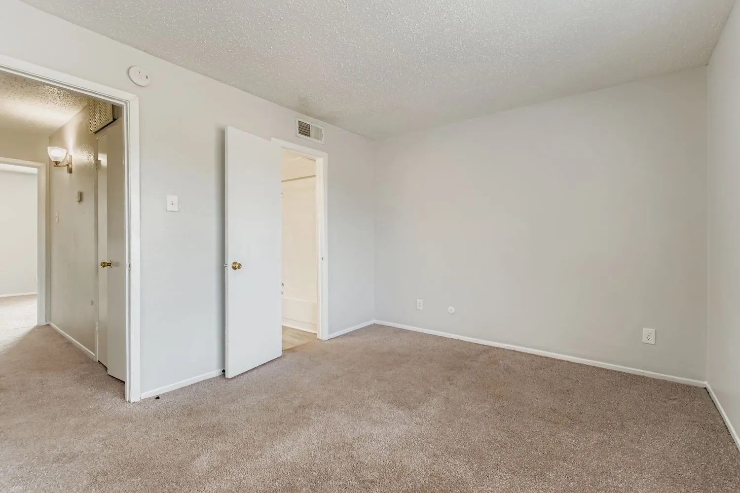 Carpeted bedroom, closet, en-suite bathroom entry