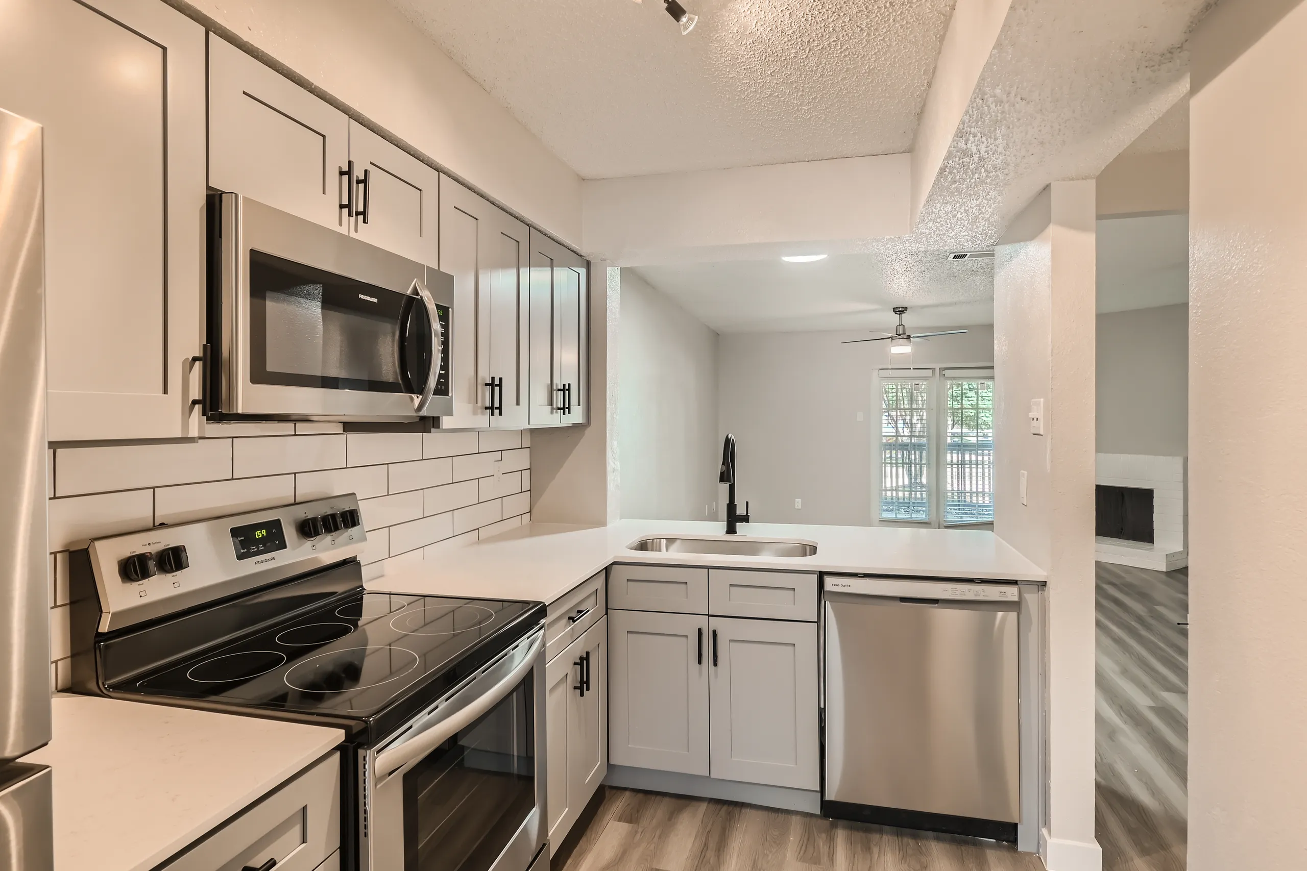 Kitchen with quartz countertops and stainless appliances