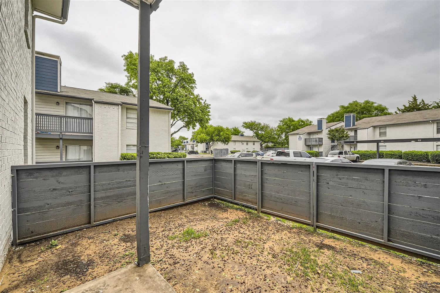 Private fenced patio with courtyard view