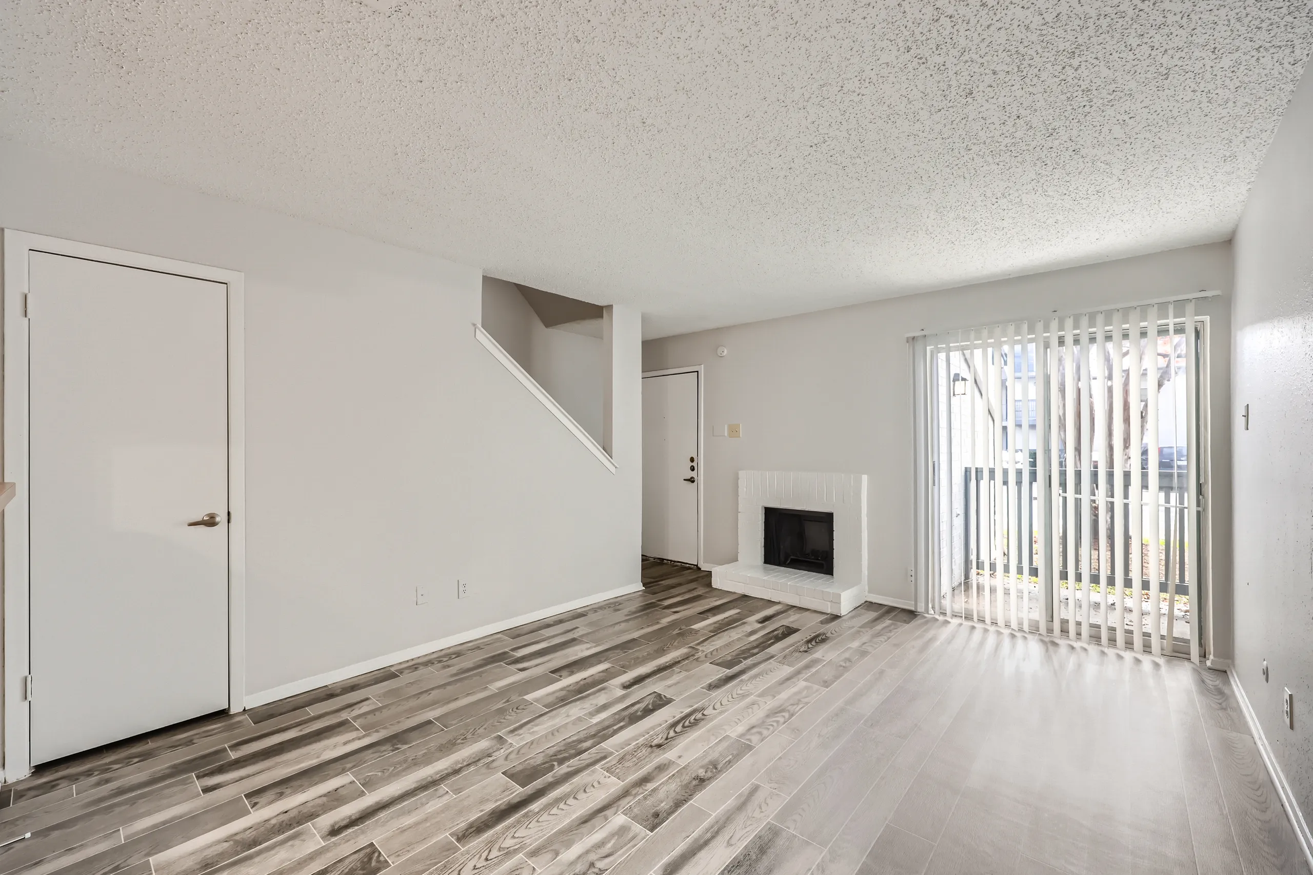 A2 Classic floor plan living room with fireplace and staircase view