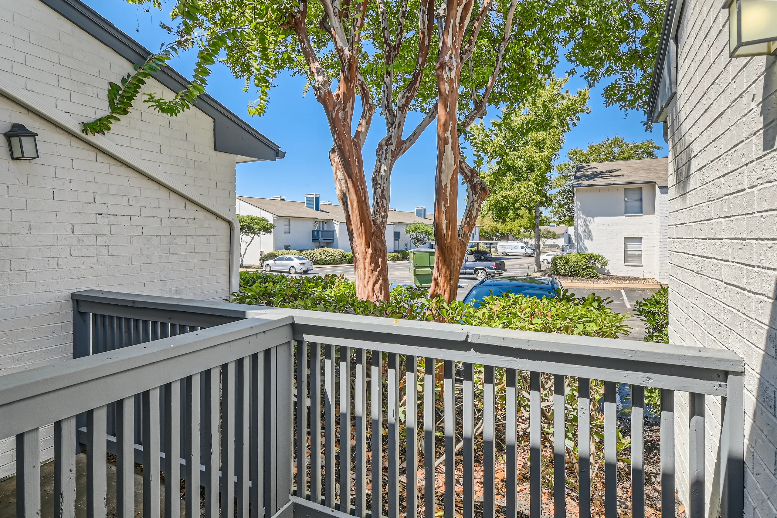 Private patio with mature trees and courtyard view