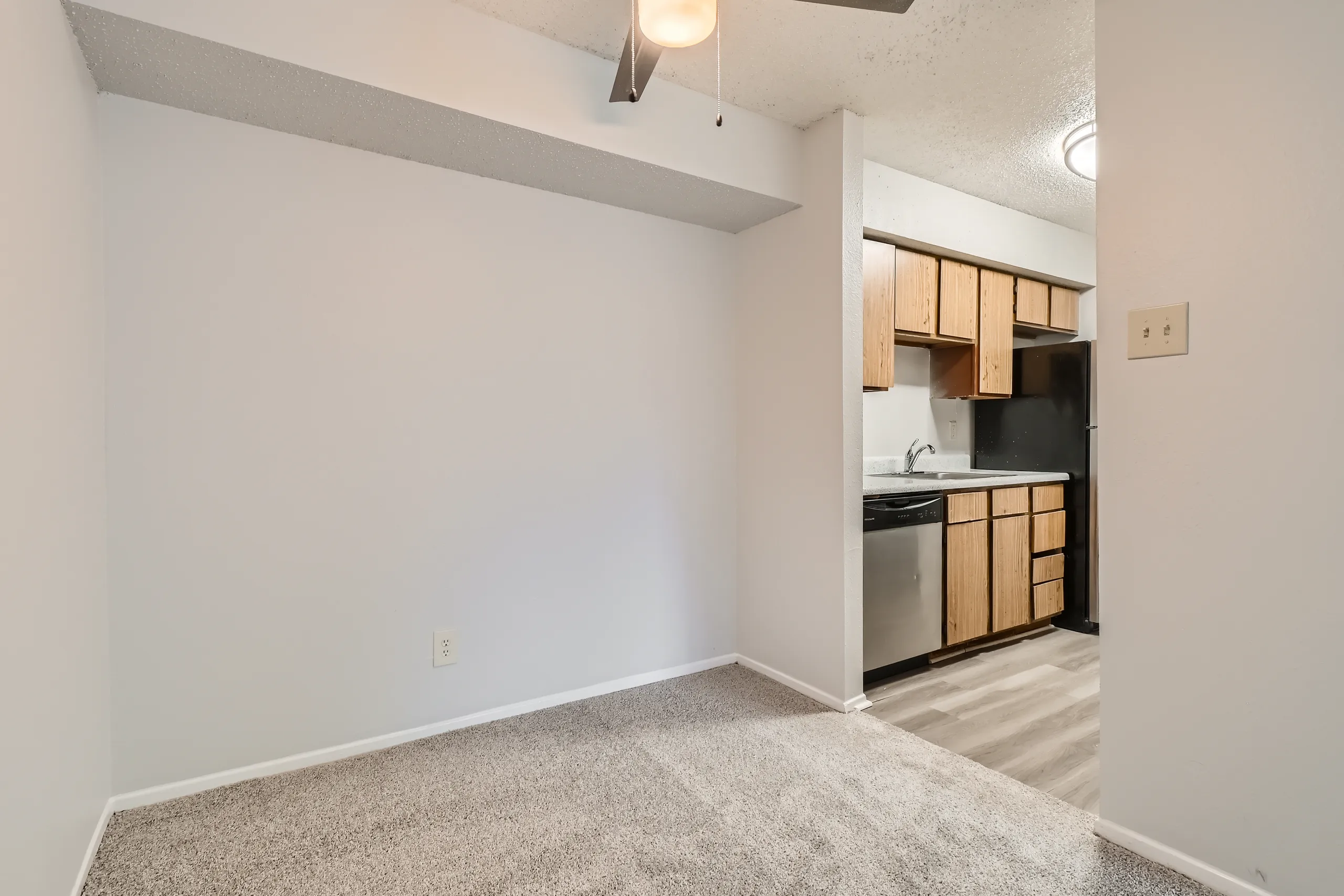 Breakfast area with ceiling fan and open kitchen view