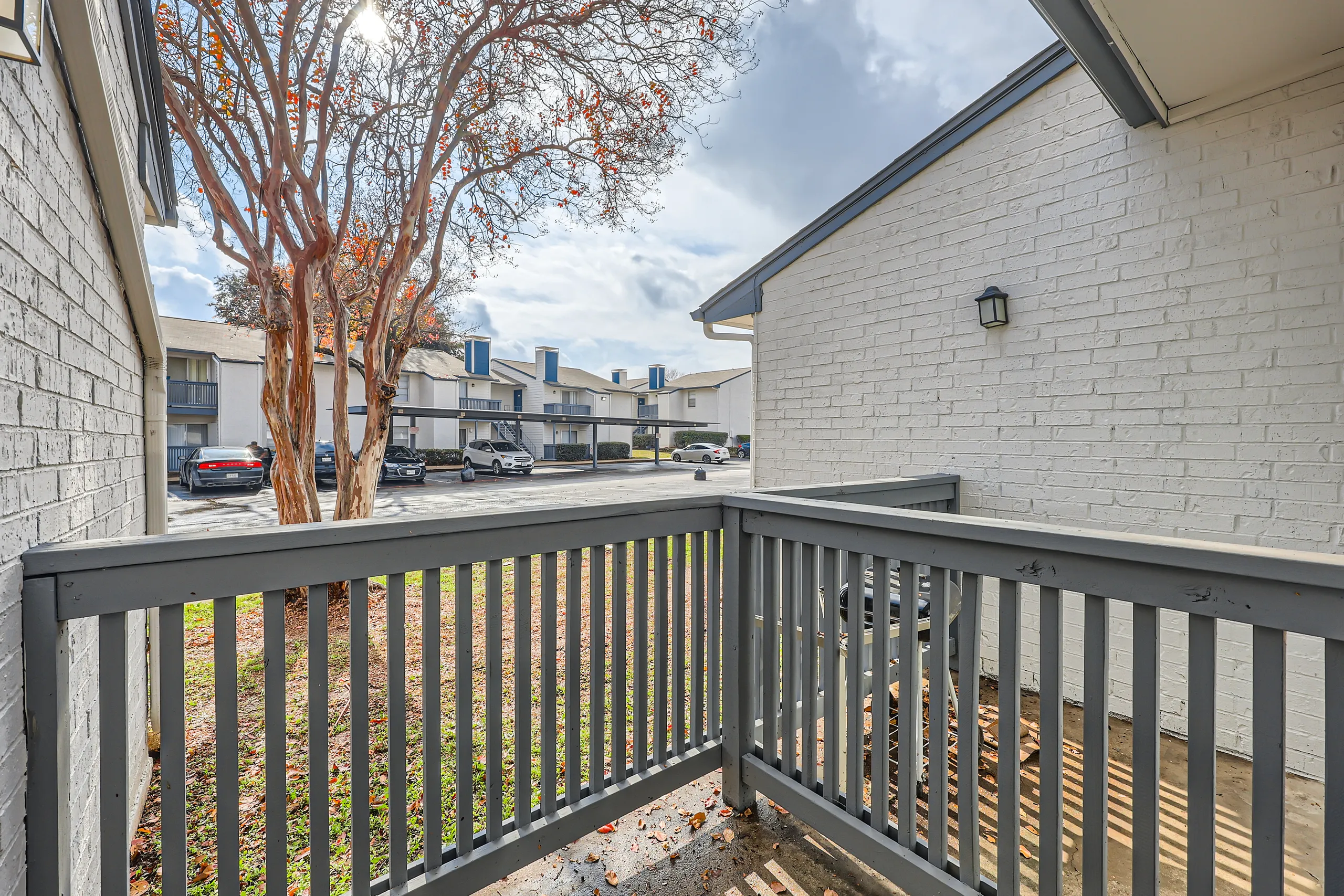 Private patio with courtyard and parking view