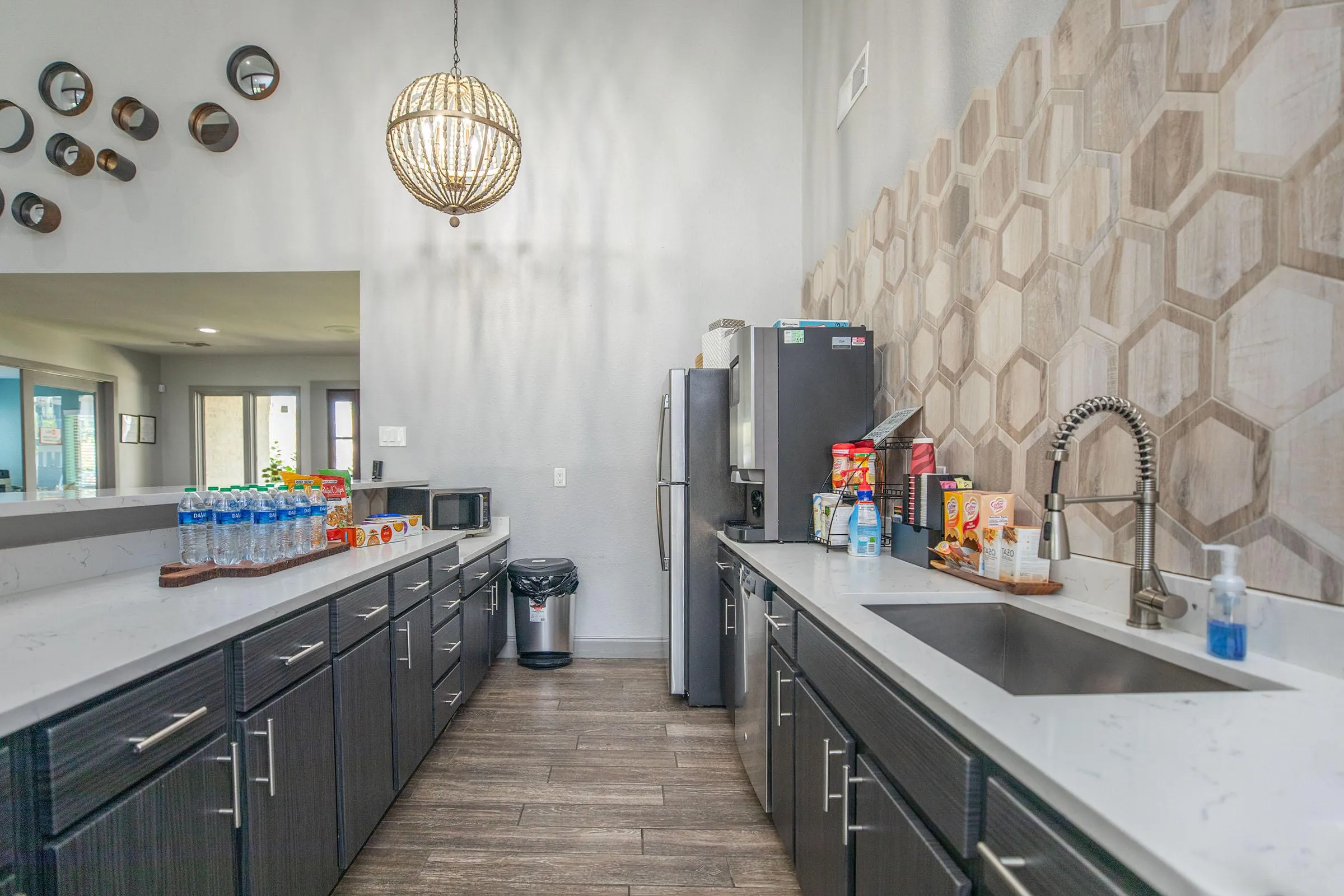 Refreshment station, quartz counters, hexagon tile, stainless appliances