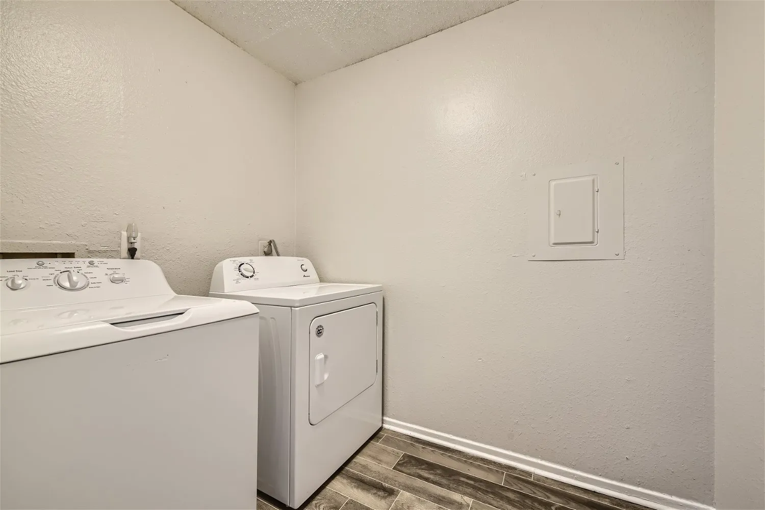 In-unit laundry room with washer and dryer