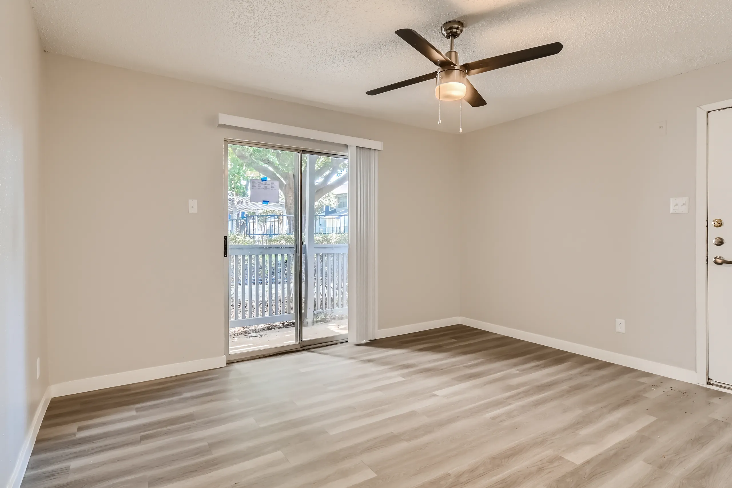 A1 Platinum floor plan living room with ceiling fan and sliding glass door
