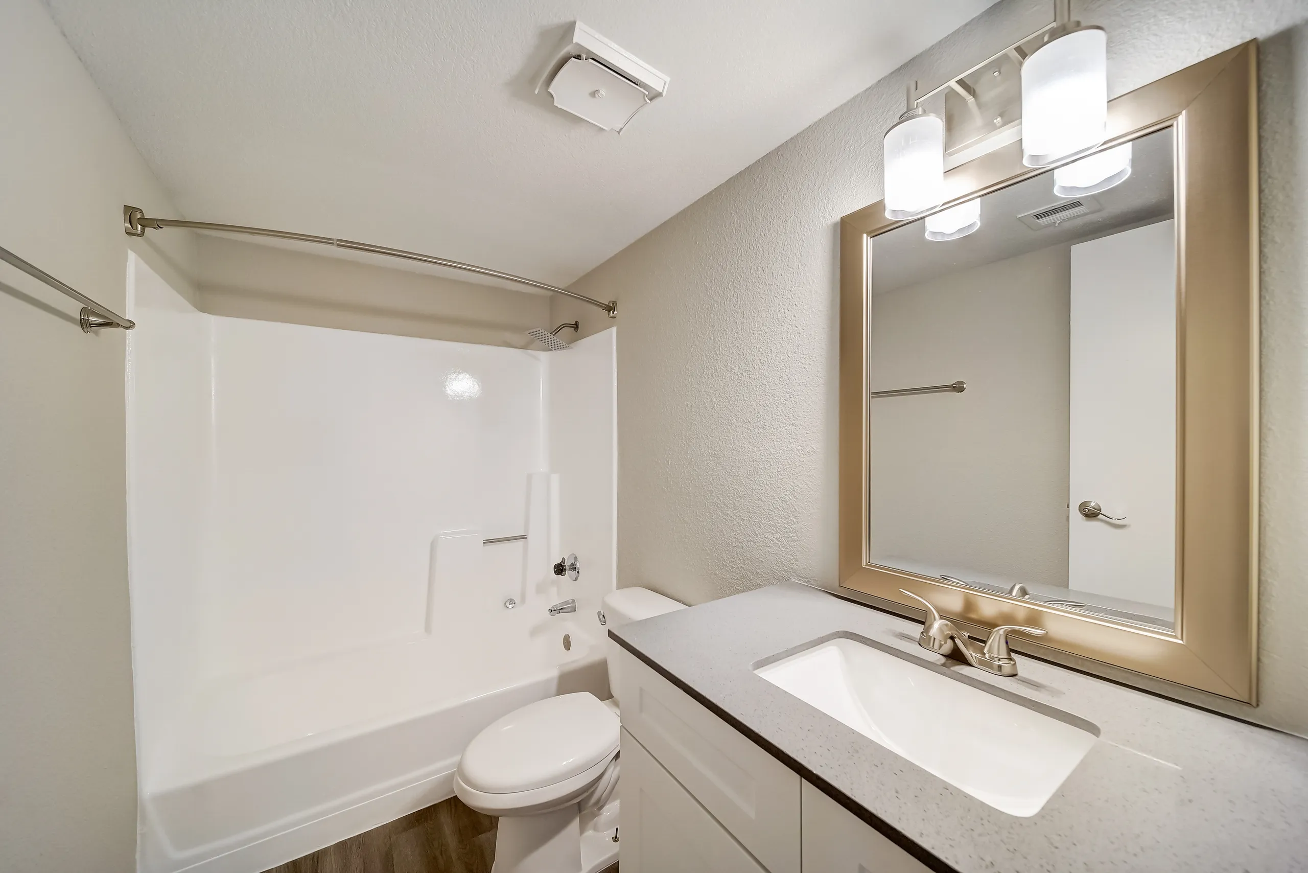 Renovated bathroom with tub/shower combo and vanity mirror